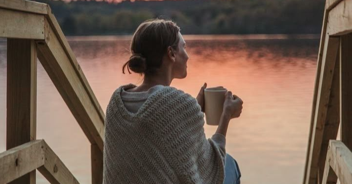 "Woman sitting alone looking exhausted and regretful — burnout irritability and snapping at loved ones in high-achieving midlife women" "Woman sitting alone looking exhausted and regretful — burnout irritability and snapping at loved ones in high-achieving midlife women"