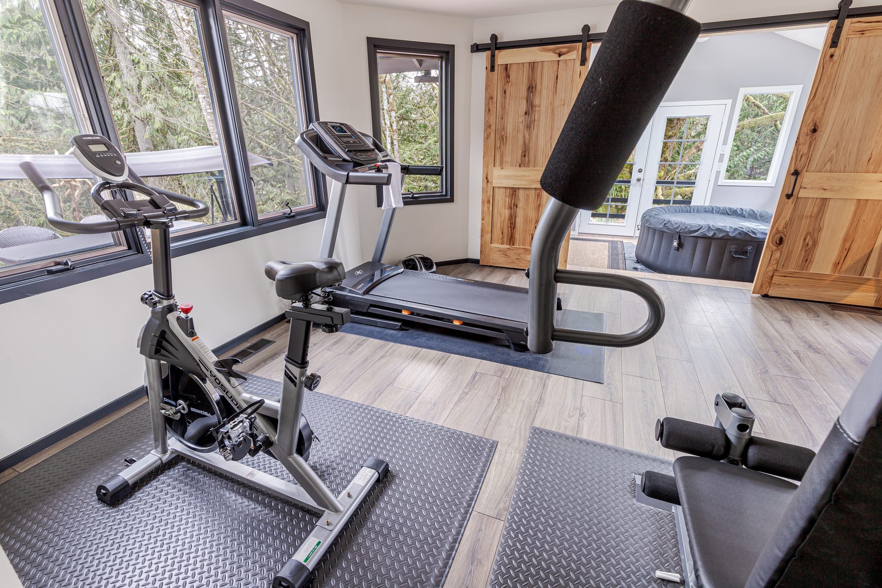 Home gym with a bike and treadmill at Jones Landing