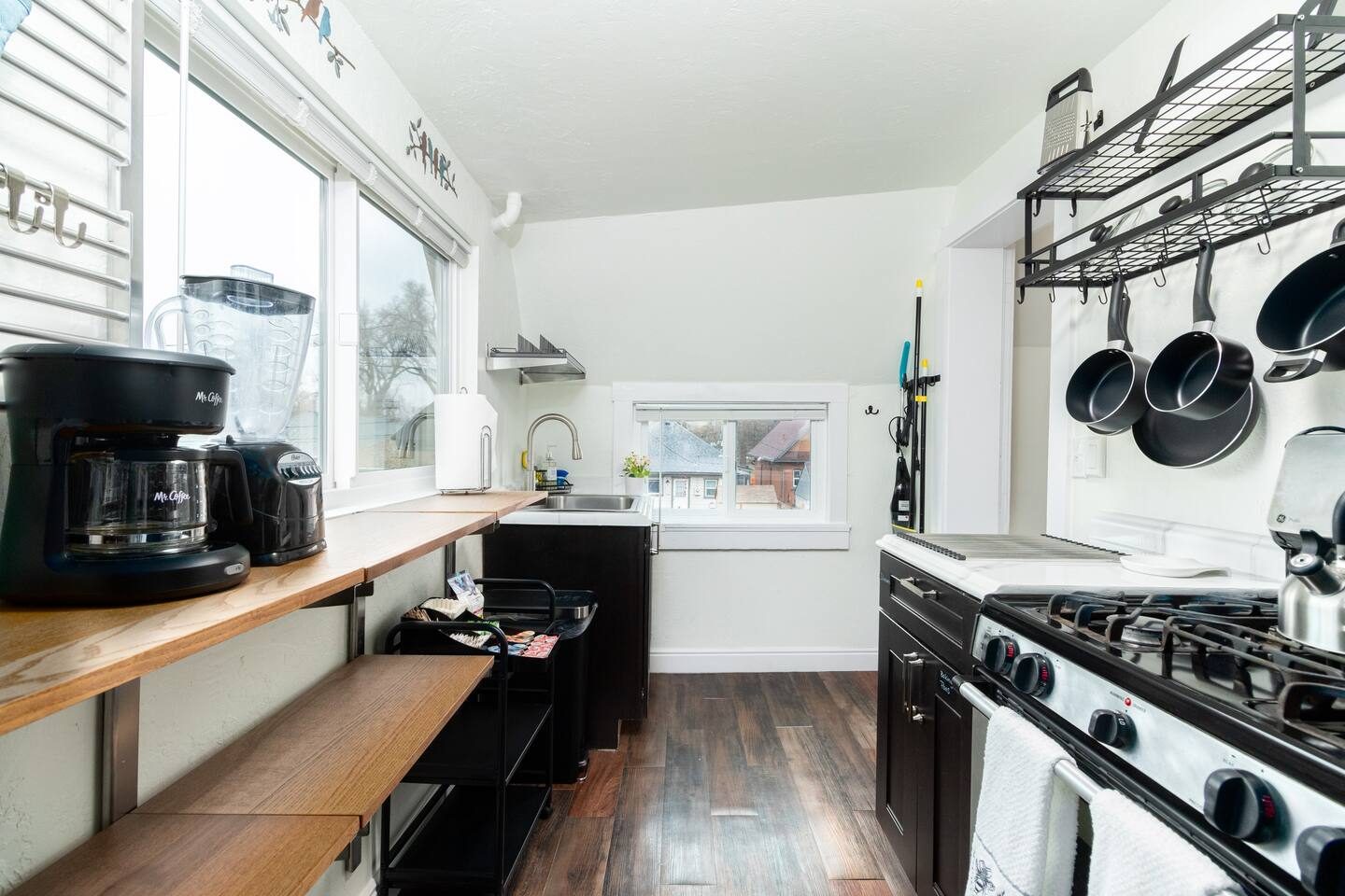 Unit 4 kitchen after, with a wood counter and open shelving