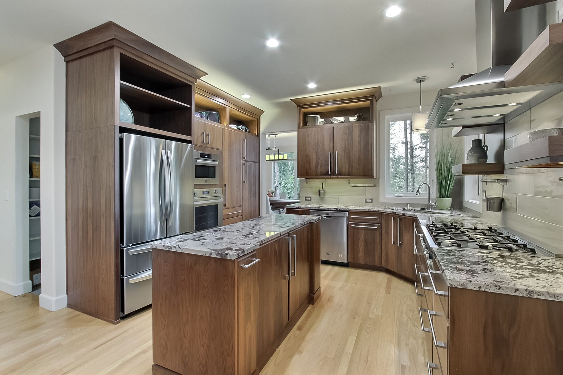 Finished kitchen after remodel with dark wood cabinets