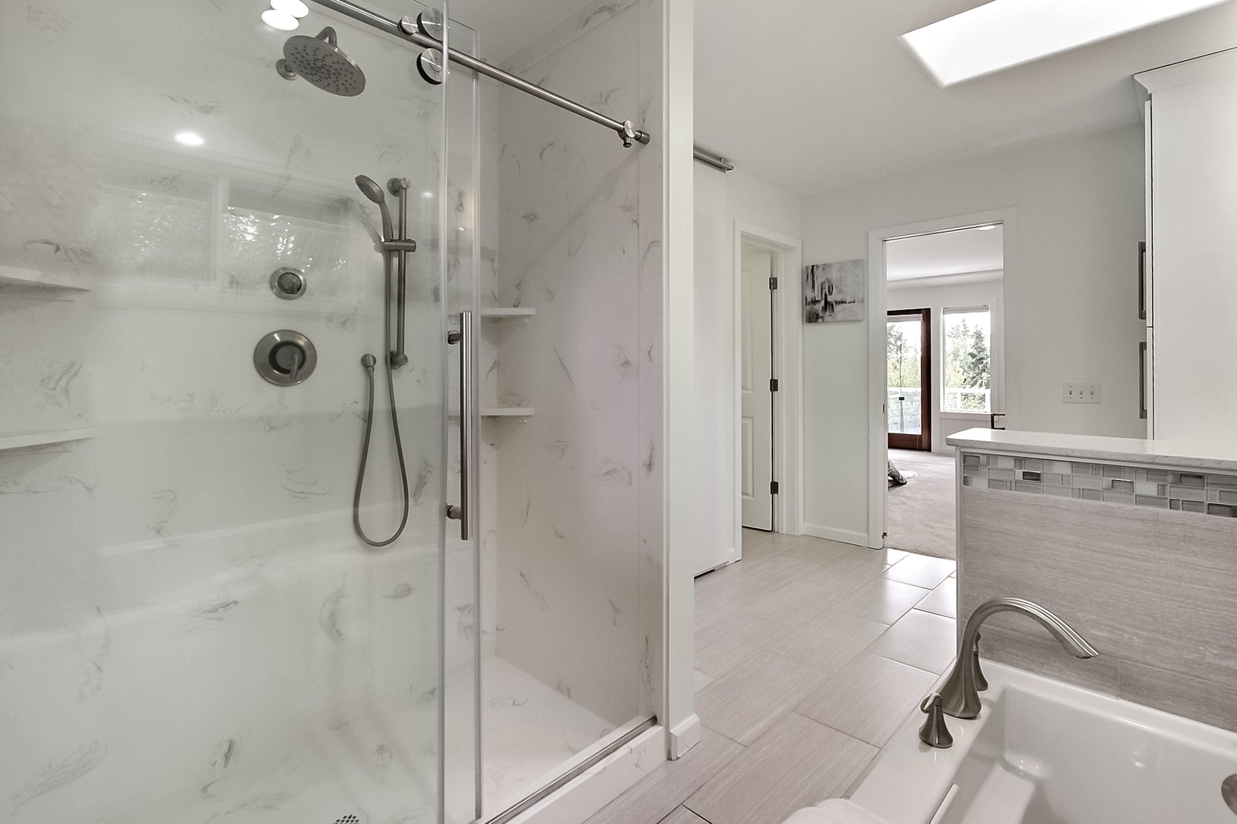 Finished master bathroom glass-door shower and skylight