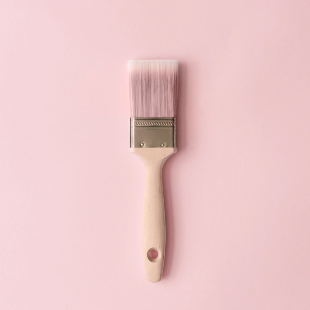 pink paint brush in a pink wall