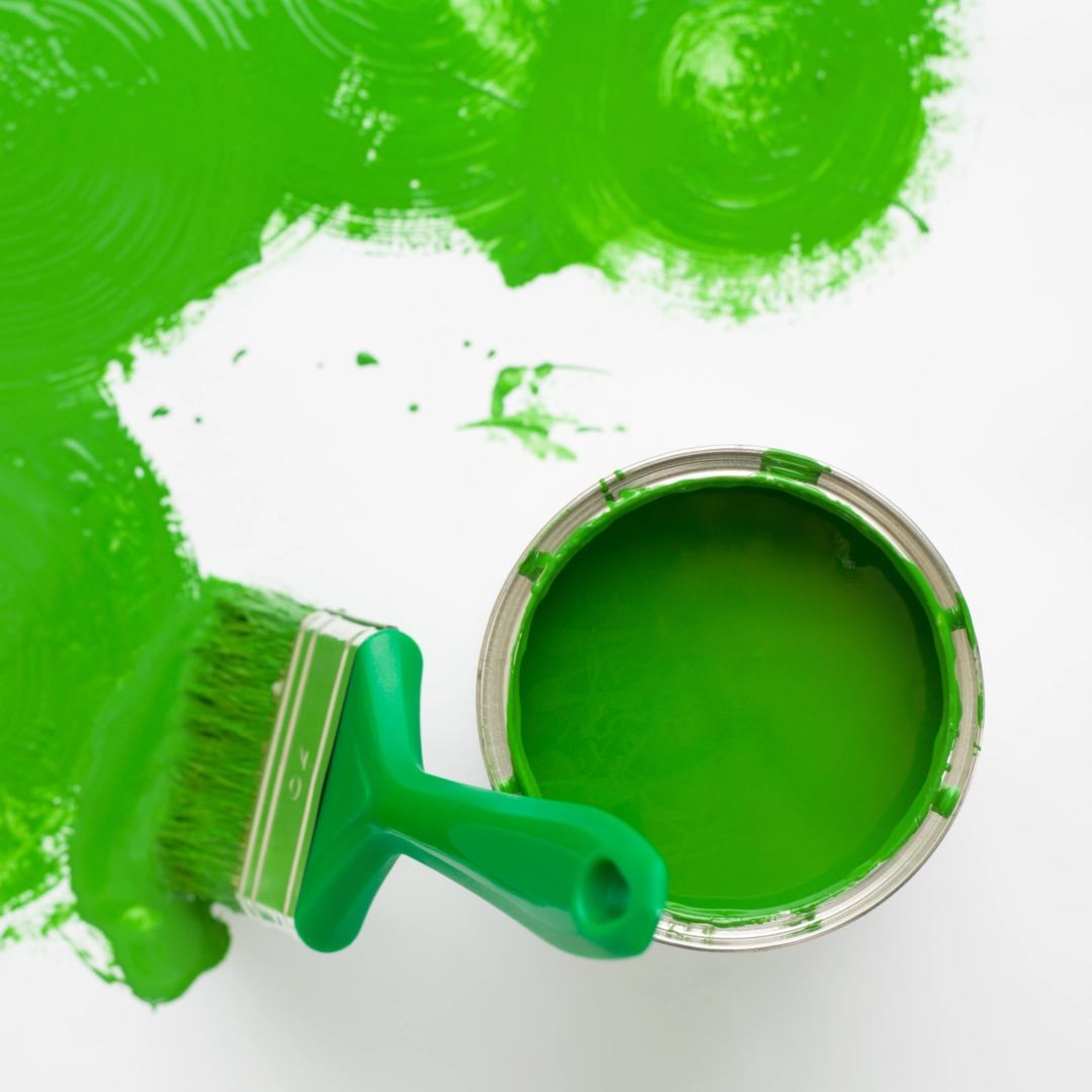 Paint bucket and paint brush ready for use in home project