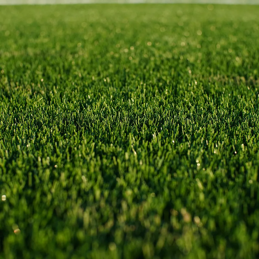Synthetic turf installation for low-maintenance landscape areas