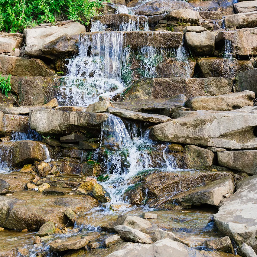 Landscape waterfall feature for outdoor spaces