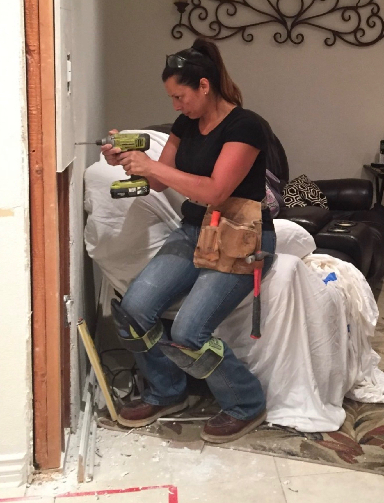 Carla Pastor of Blue Ribbon installing framing during a kitchen remodel