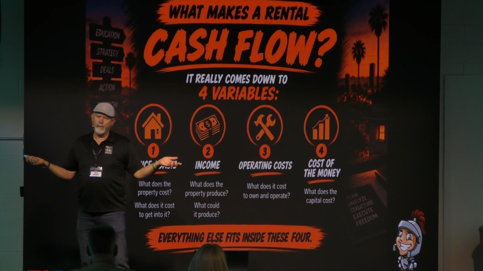 Evan Brown on stage at the FIRE Center explaining the four variables behind rental cash flow