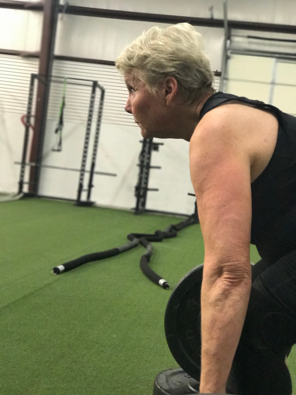 A client practicing a strength movement on the iRISE training turf