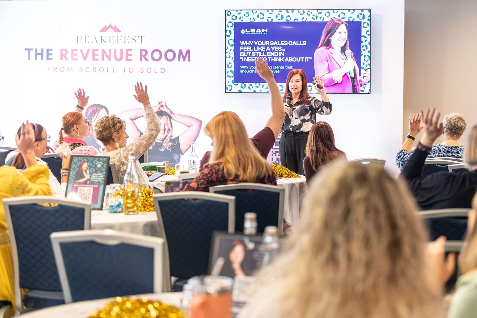 Leah Gregory teaching sales to a room of business owners
