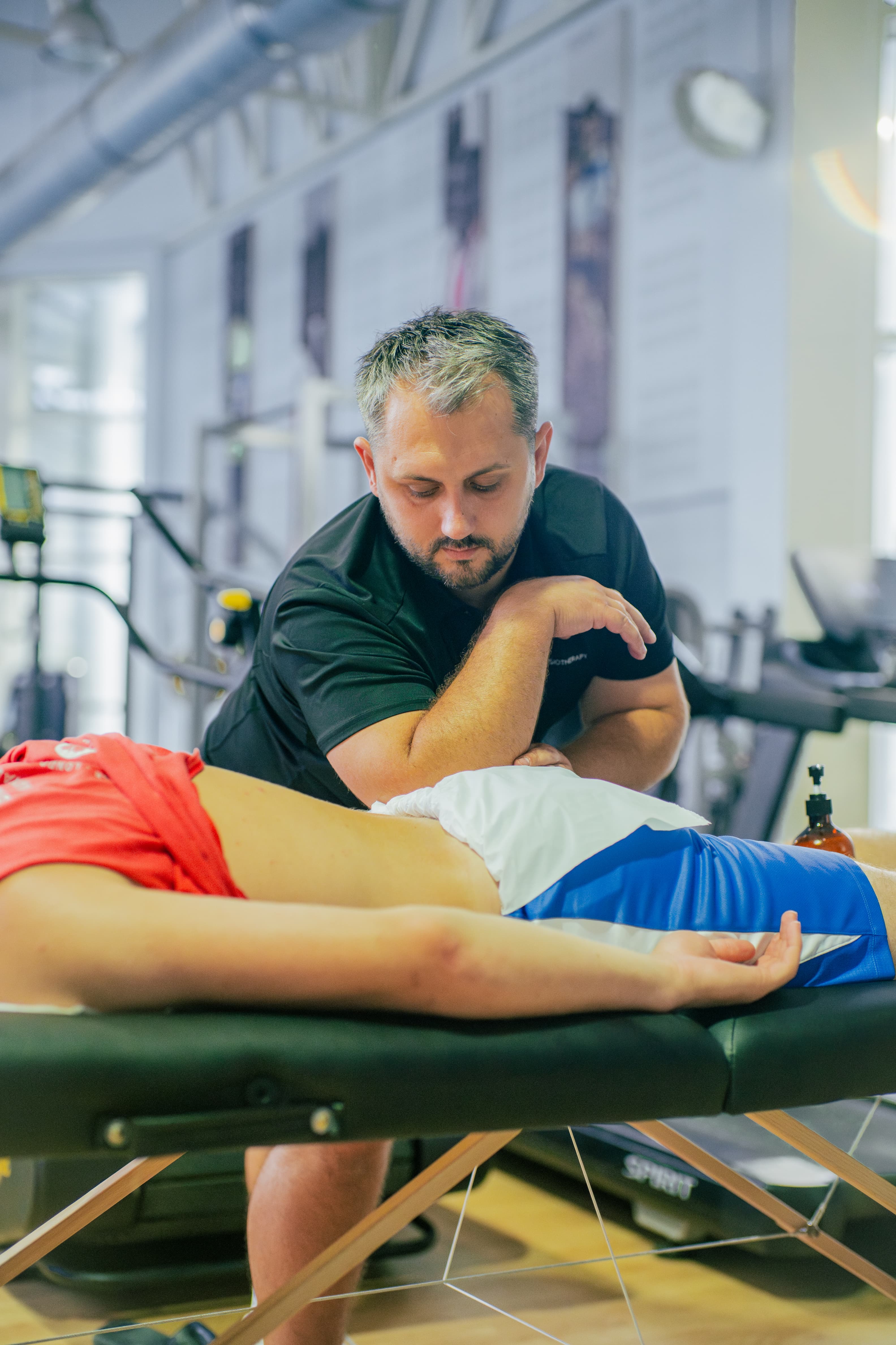 A RED Physiotherapy clinician treating a patient