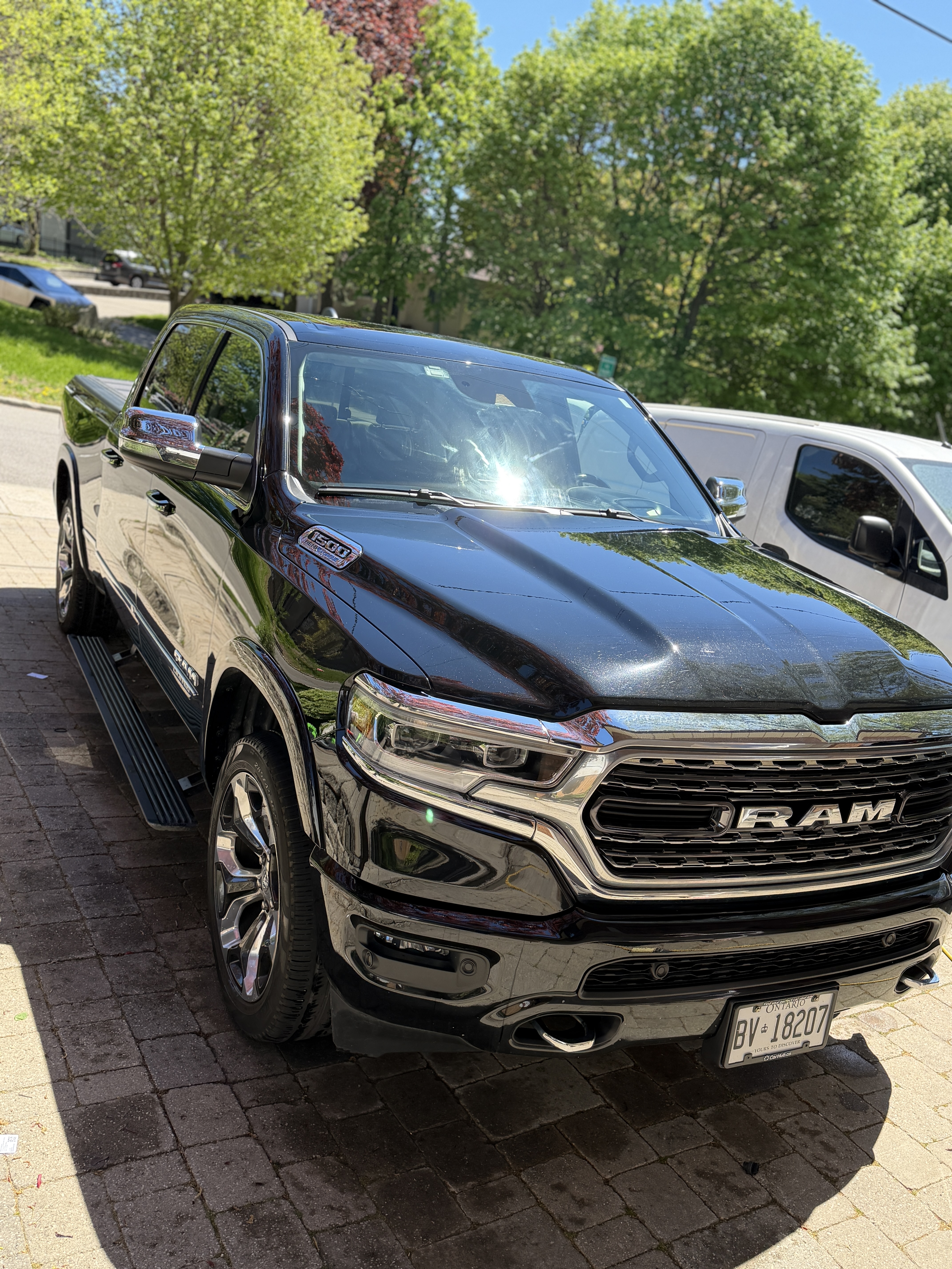 Glossy black pickup truck with a high-shine finish after wash and wax