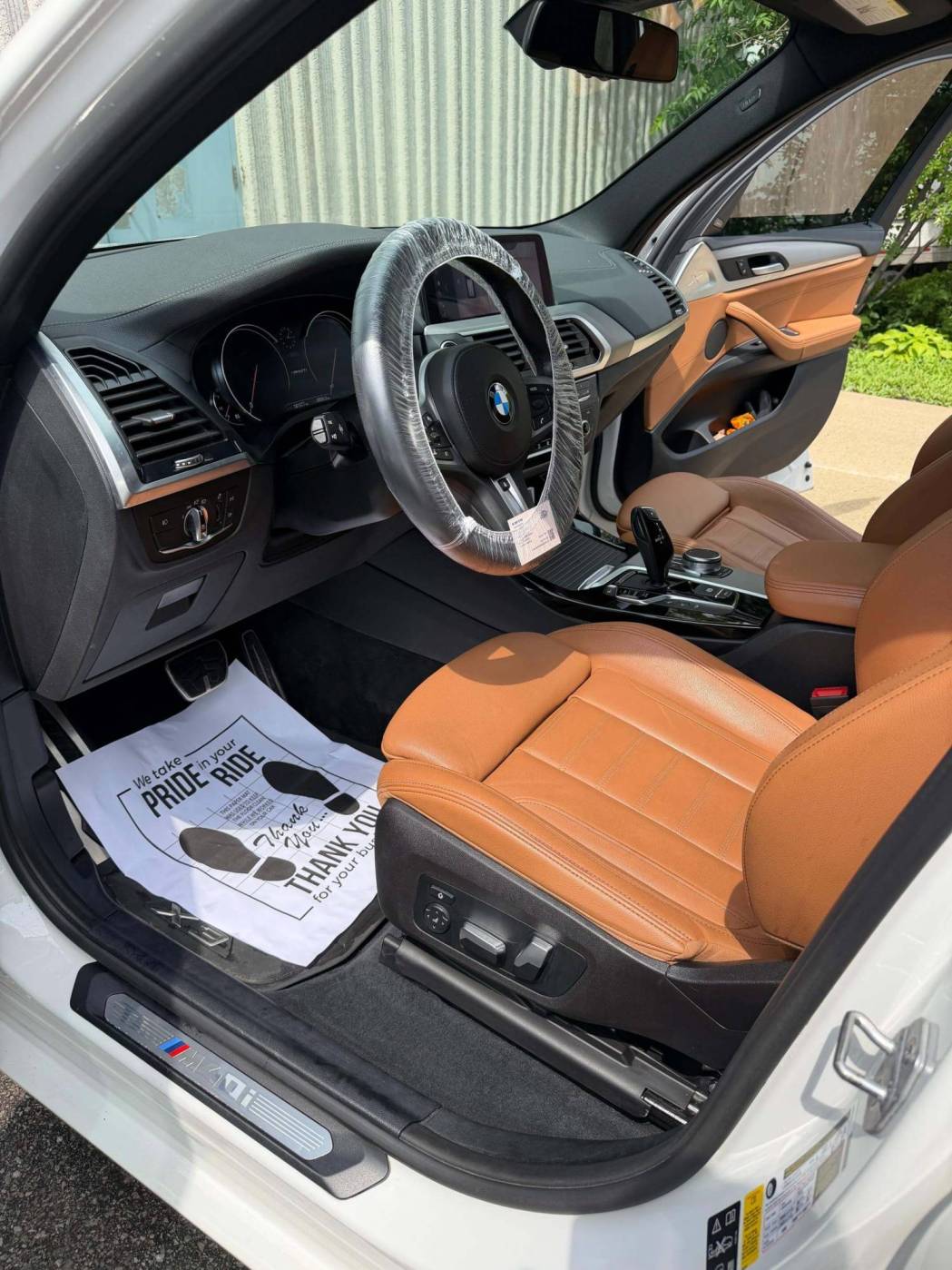 Steam-cleaned car seats and carpets during premium interior detailing