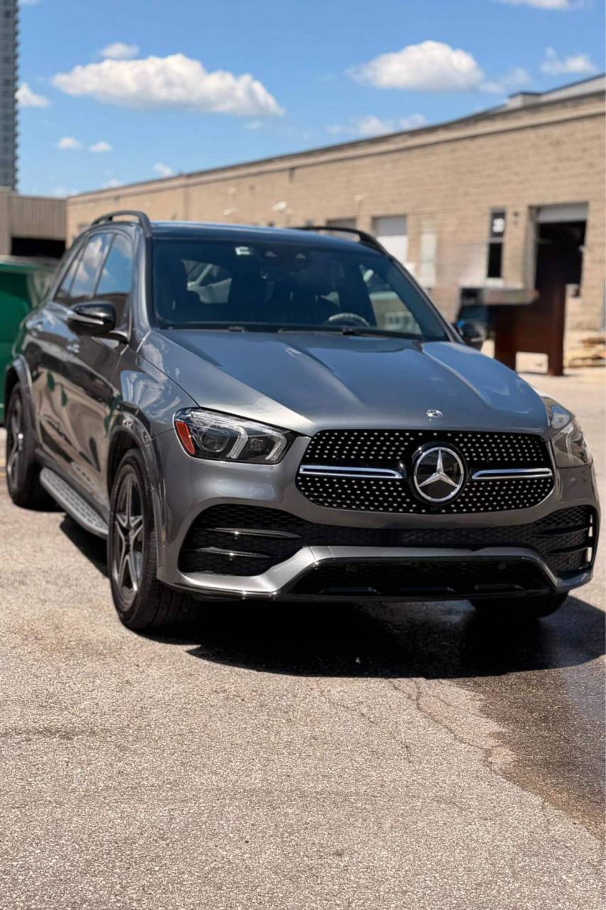 Glossy black pickup truck with a high-shine finish after wash and wax