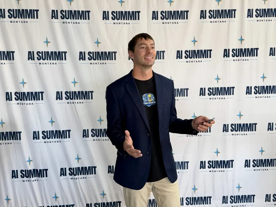 Dylan Solberg presenting on stage at AI Summit