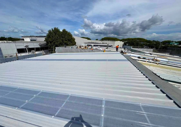 Roof maintenance and repair work on a commercial building in Auckland