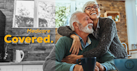 Medicare Covered. A couple relaxing together at home with coffee.