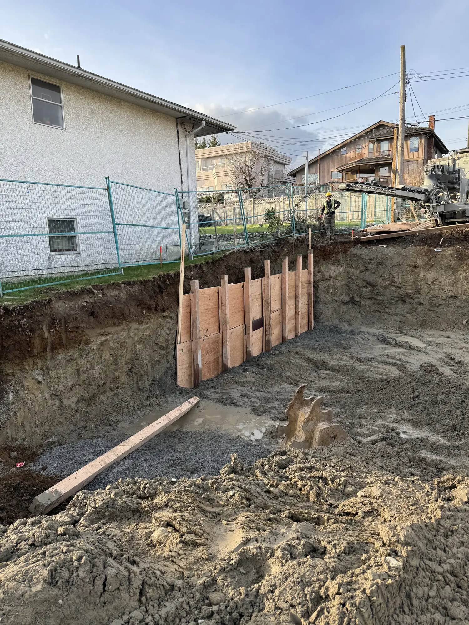 Timber lagging shoring bracing a deep cut in North Vancouver BC