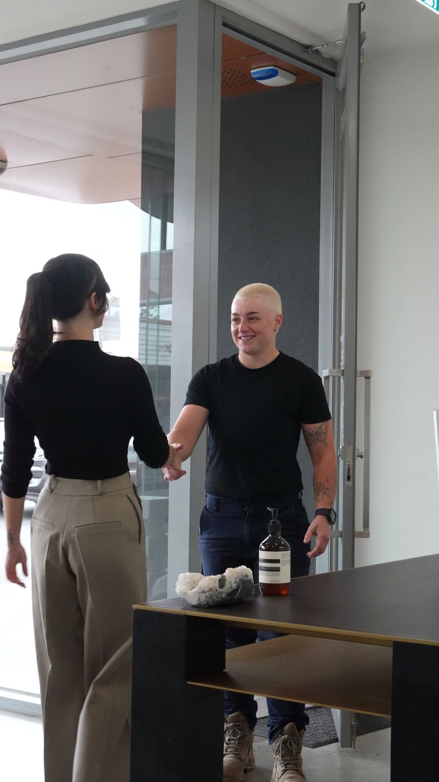 Nikki greeting a patient in clinic