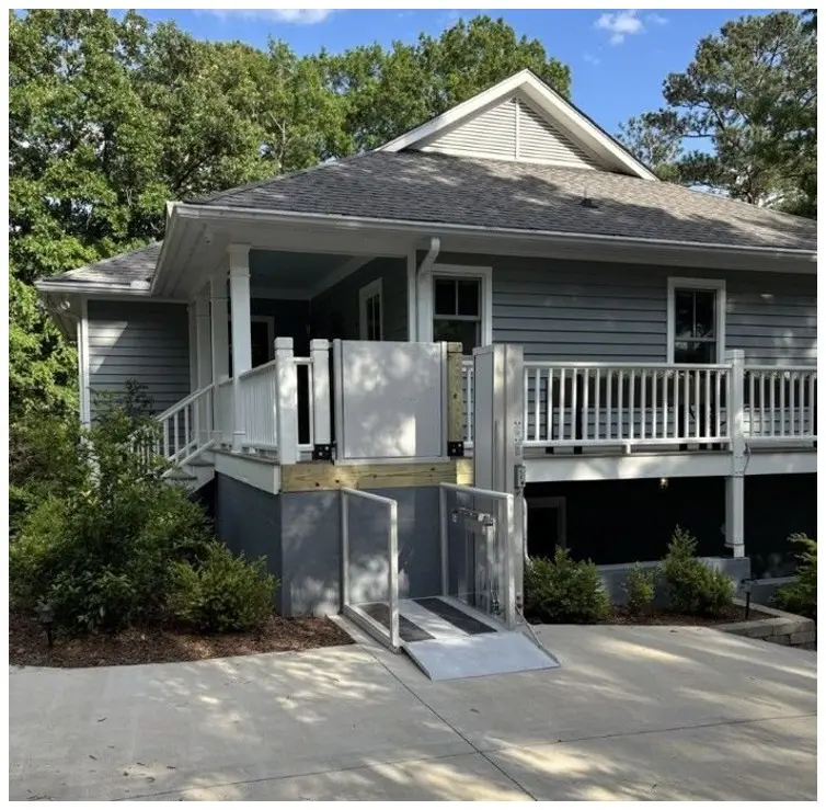 Vertical platform lift providing safe outdoor access to a home