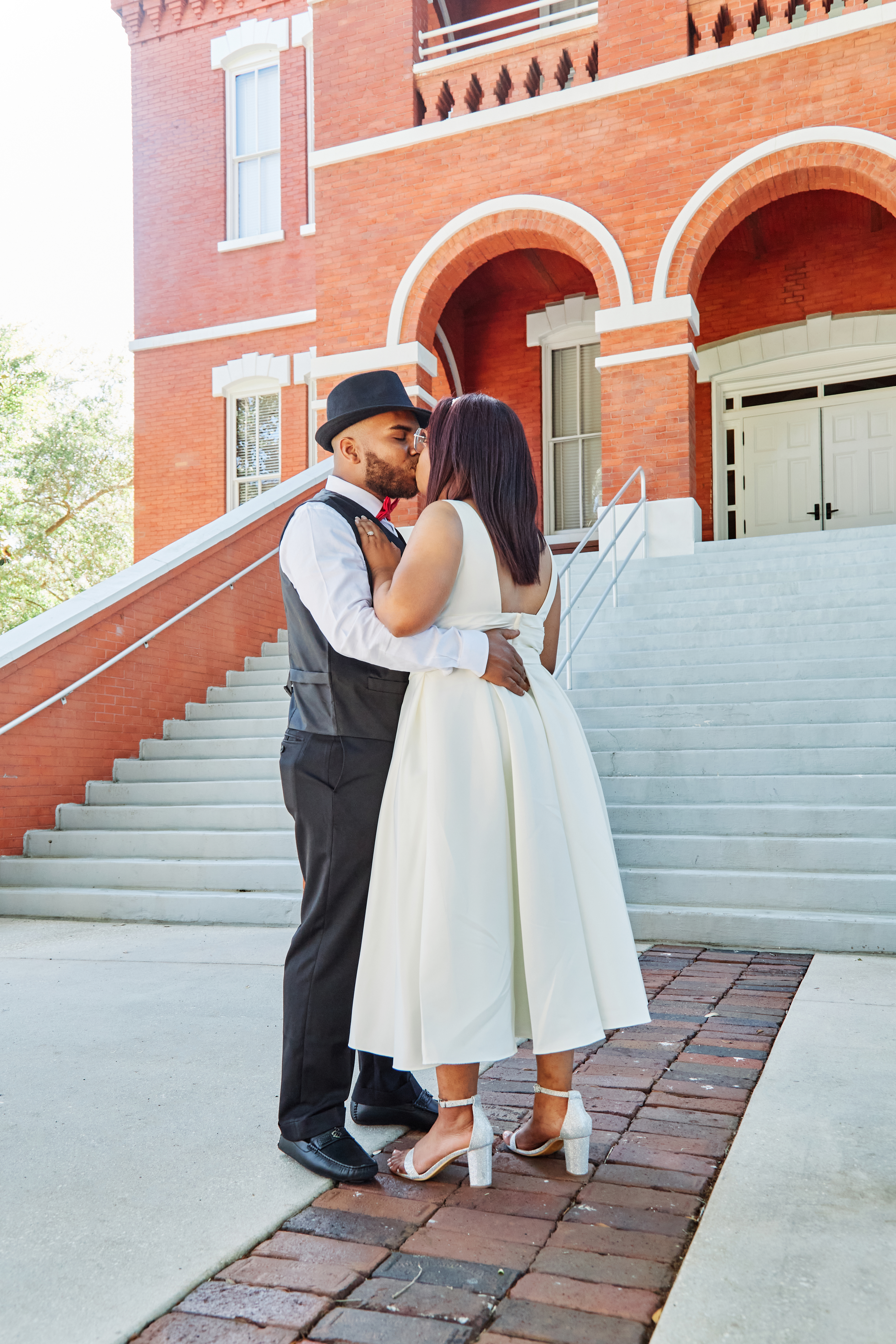 Couple kissing while posing in Kissimmee after their elopement