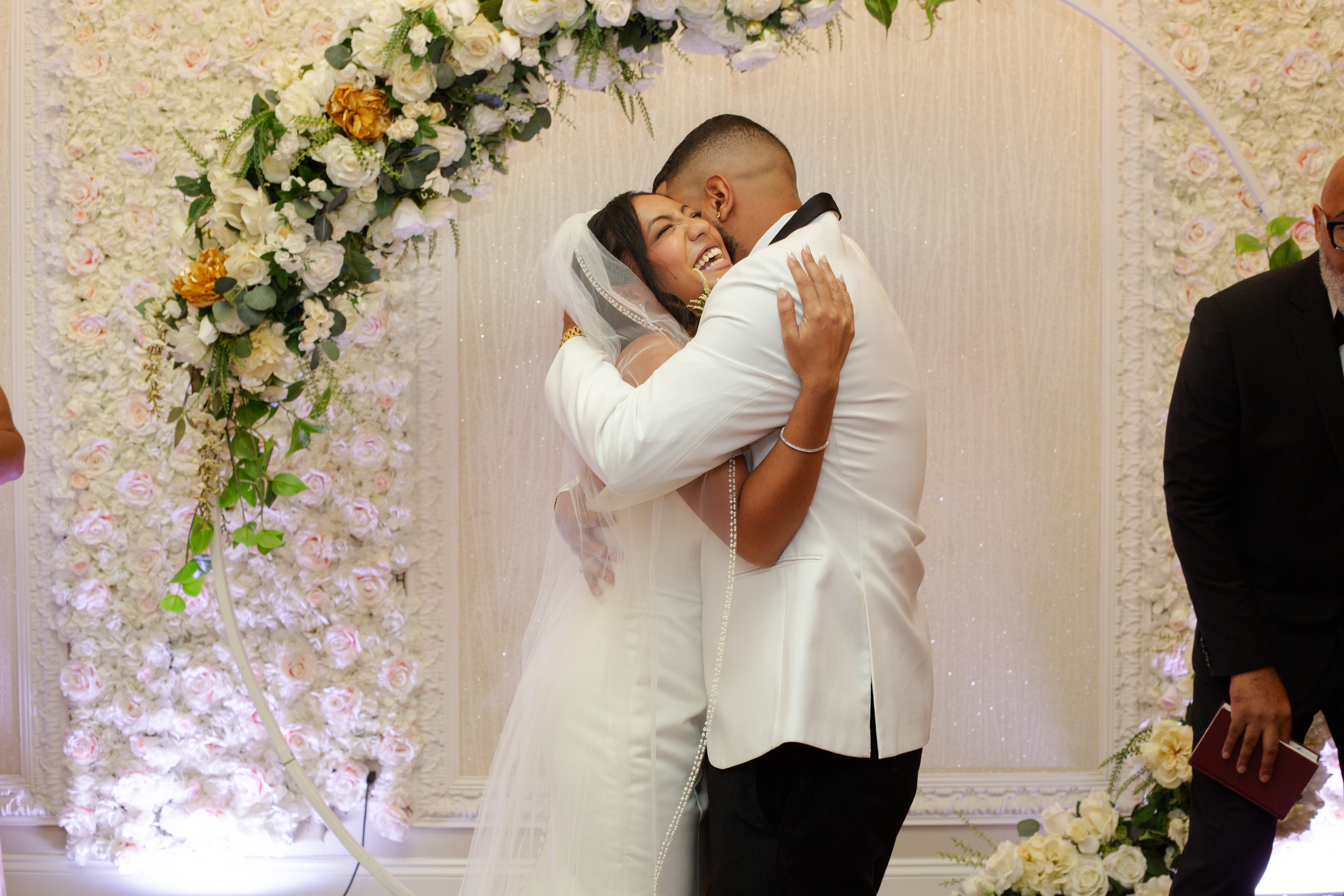 Couple hugging at their wedding