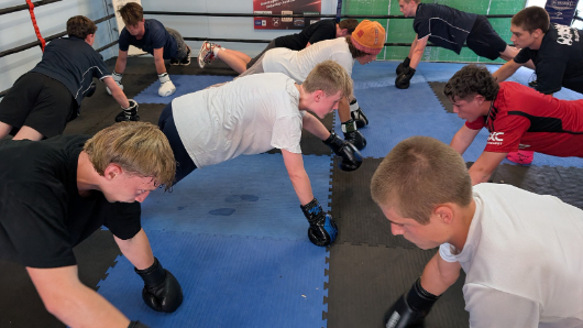 Teenagers training with boxing gloves