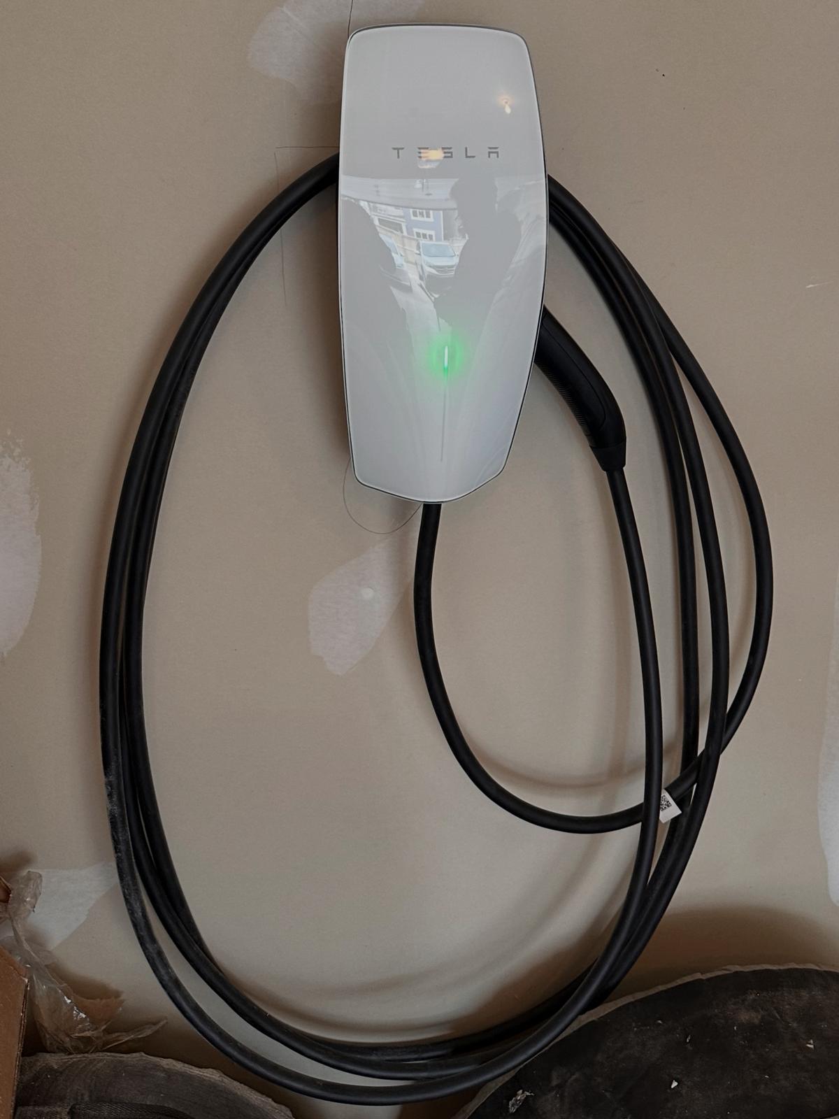 Tesla Wall Connector EV charger installed in a residential garage by Zap Electric Corp