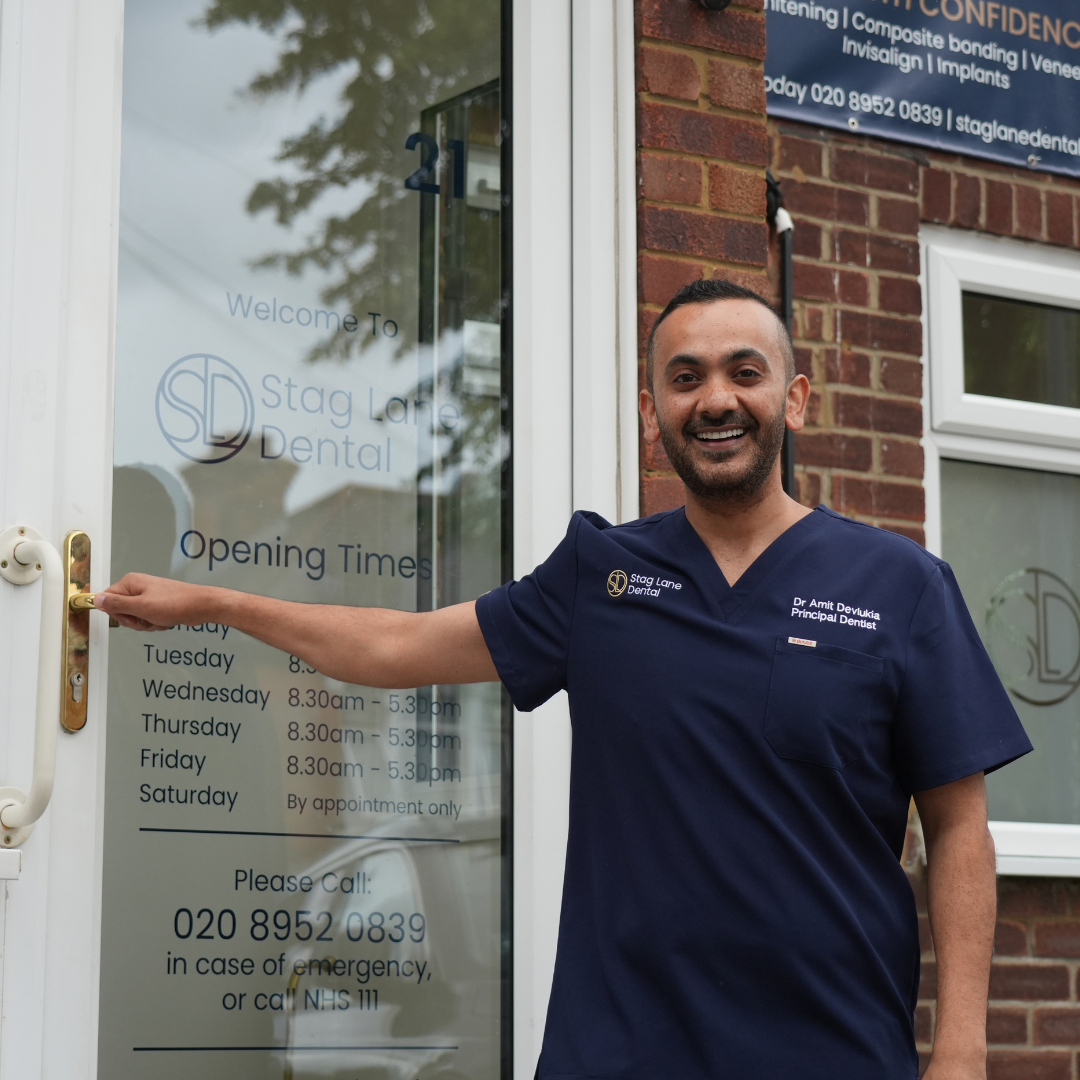 A Stag Lane Dental dentist welcoming you at the practice entrance
