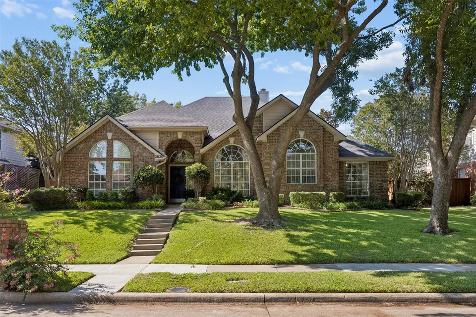 A brick two-story home listed for sale