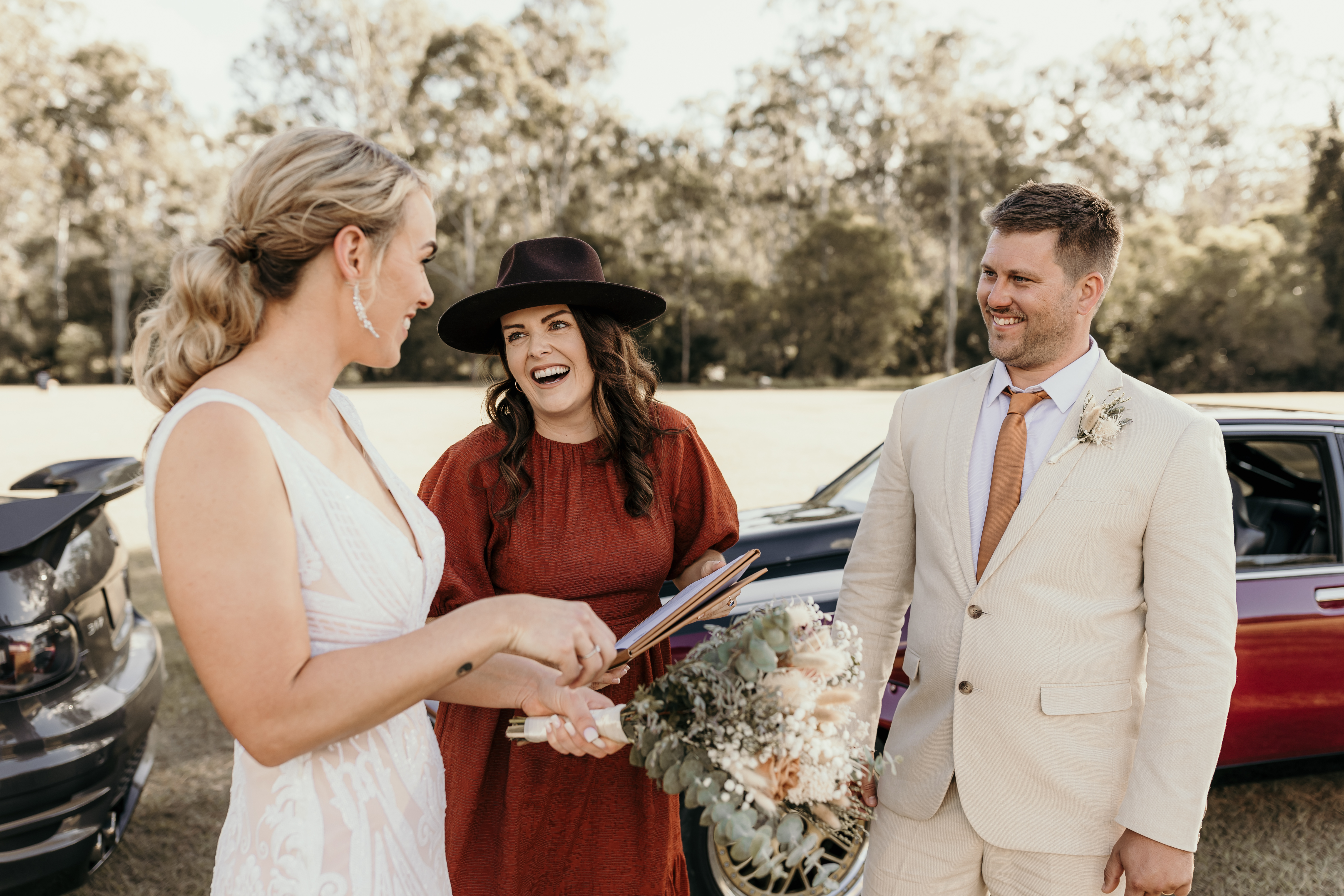 Danielle laughing with a couple
