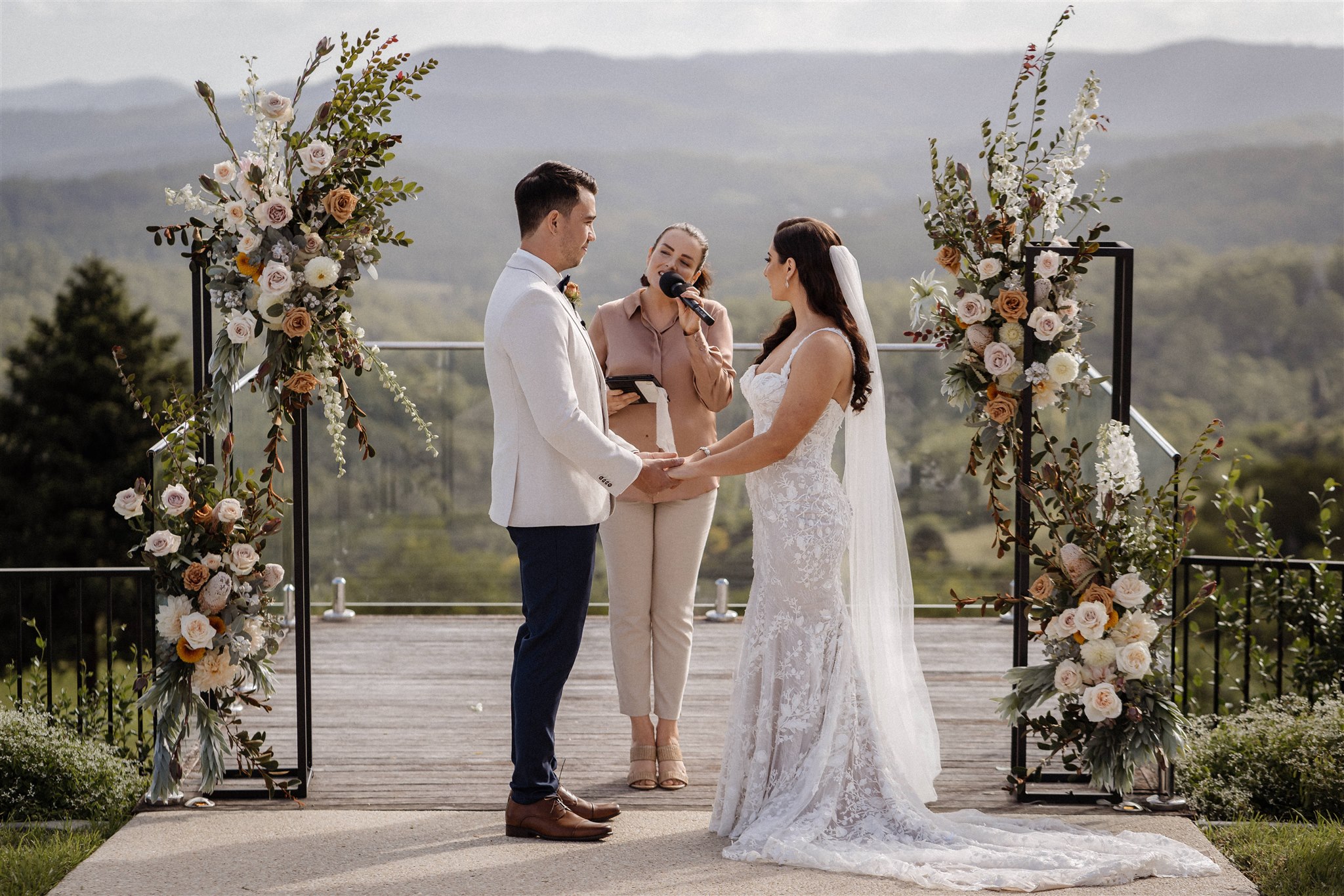 Danielle hosting a wedding ceremony with a microphone