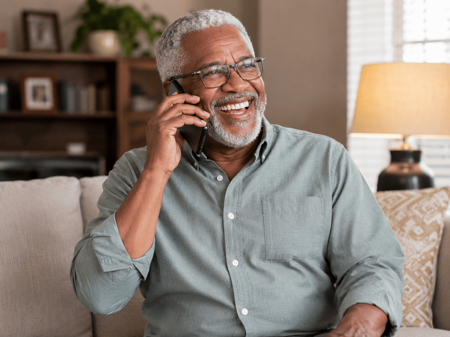 Happy senior woman talking on smartphone