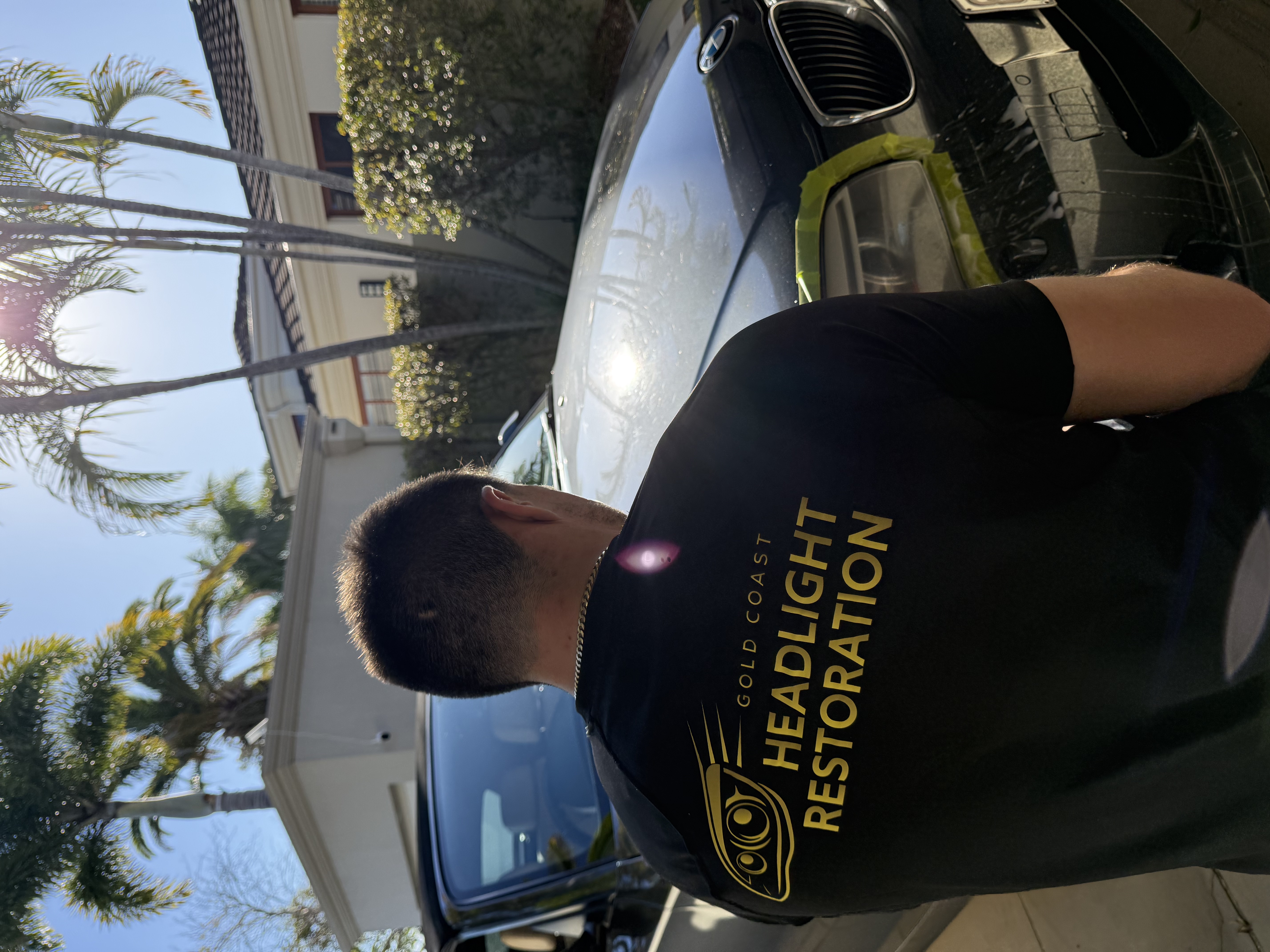 Aurelius at work restoring a headlight, Gold Coast Headlight Restorations
