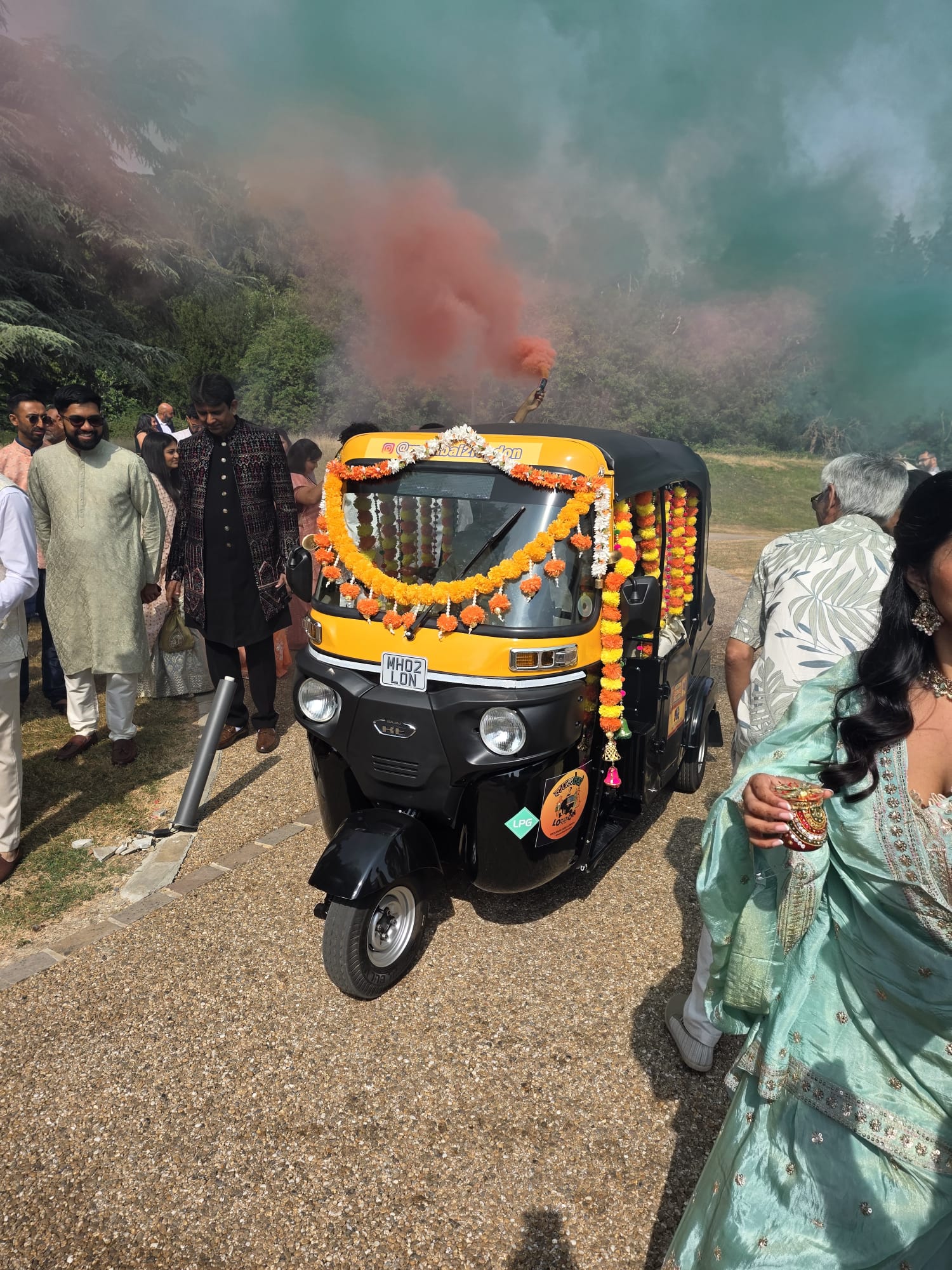 Fully decorated Mumbai2London rickshaw (tuk tuk) with garlands, Brass Bells & Custom Art