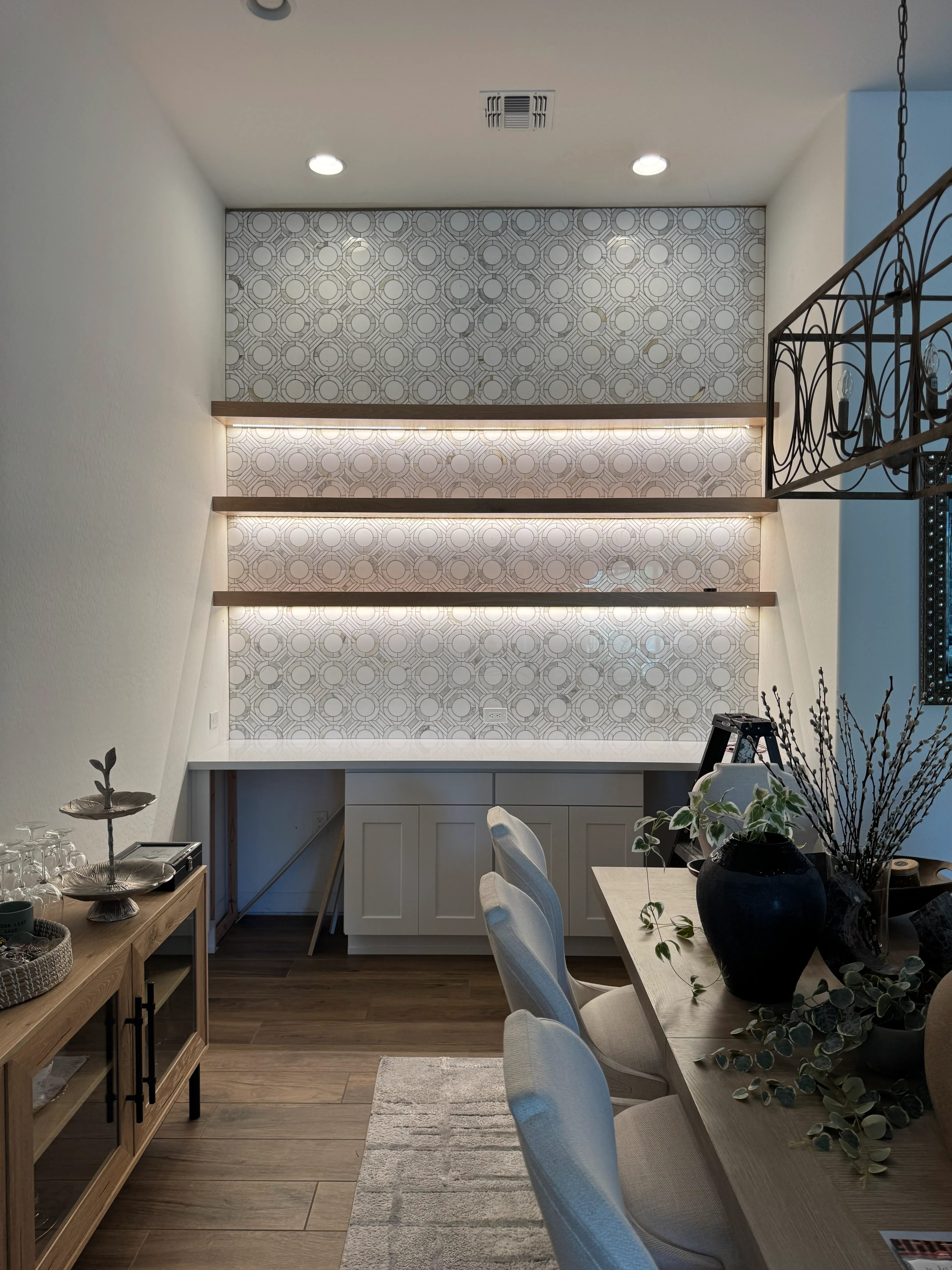 Recessed and integrated shelf lighting in a finished dining area