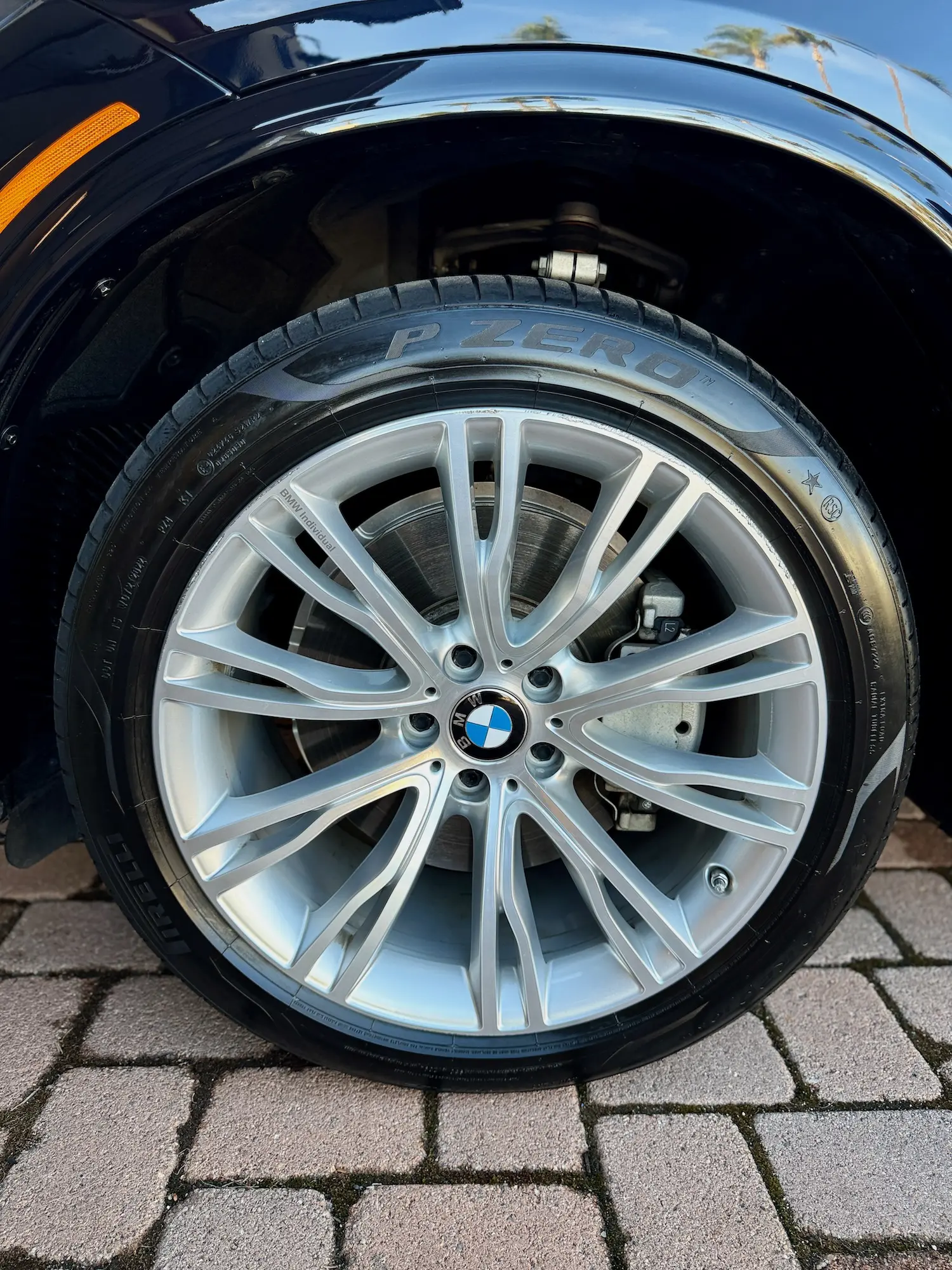 Close-up of BMW wheel and Pirelli P Zero tire after detailing.