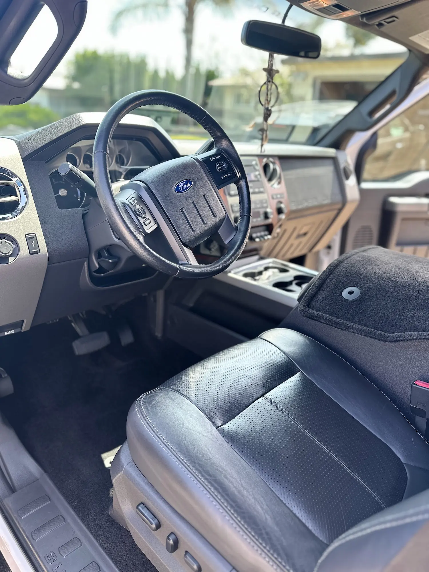 Pristine interior of a Ford truck with leather seats and dashboard sparkling from an interior detail session.