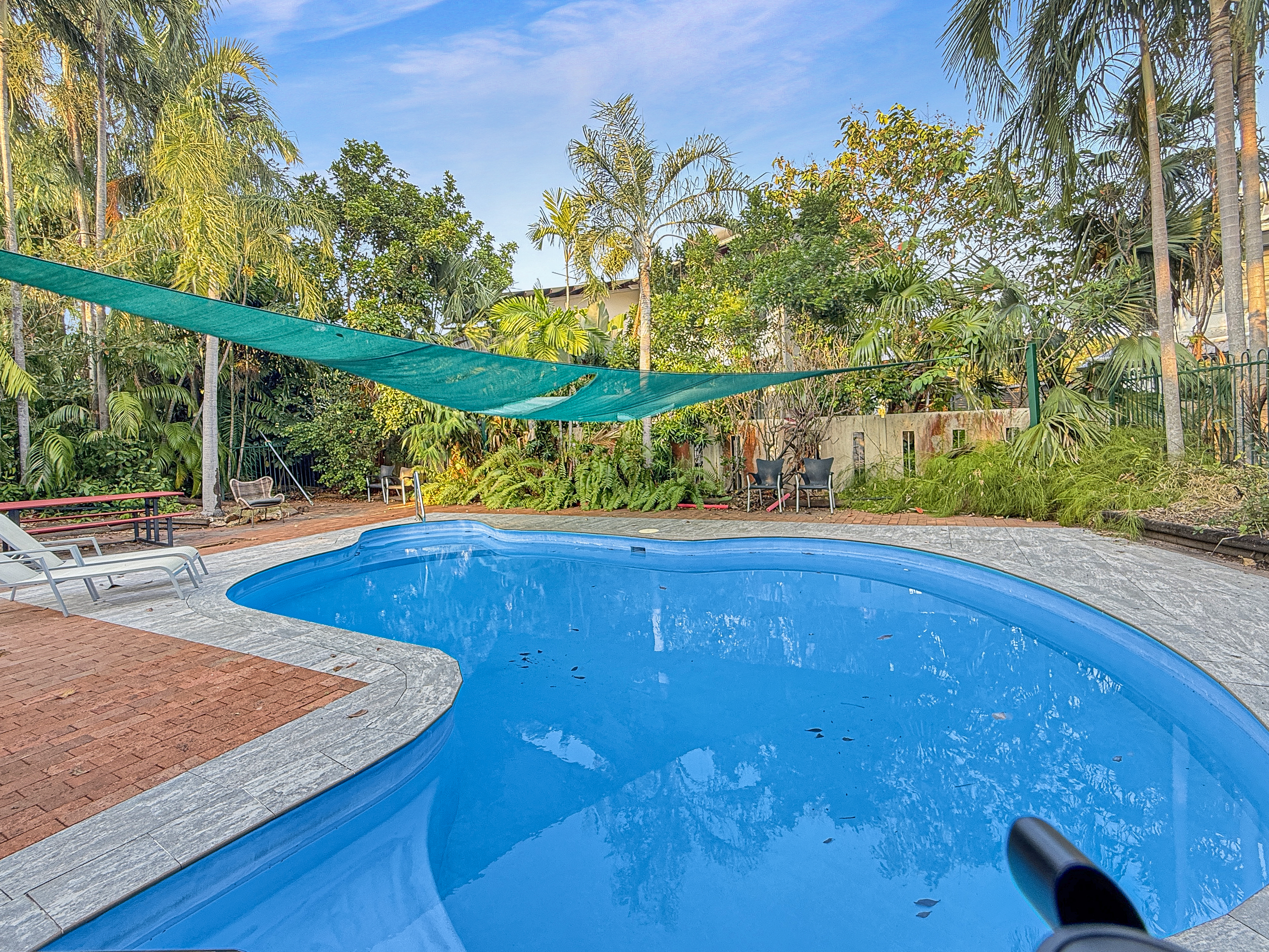 Swimming pool within the complex at 76/16 Hudson Fysh Avenue Parap, surrounded by tropical gardens and resort-style outdoor spaces.