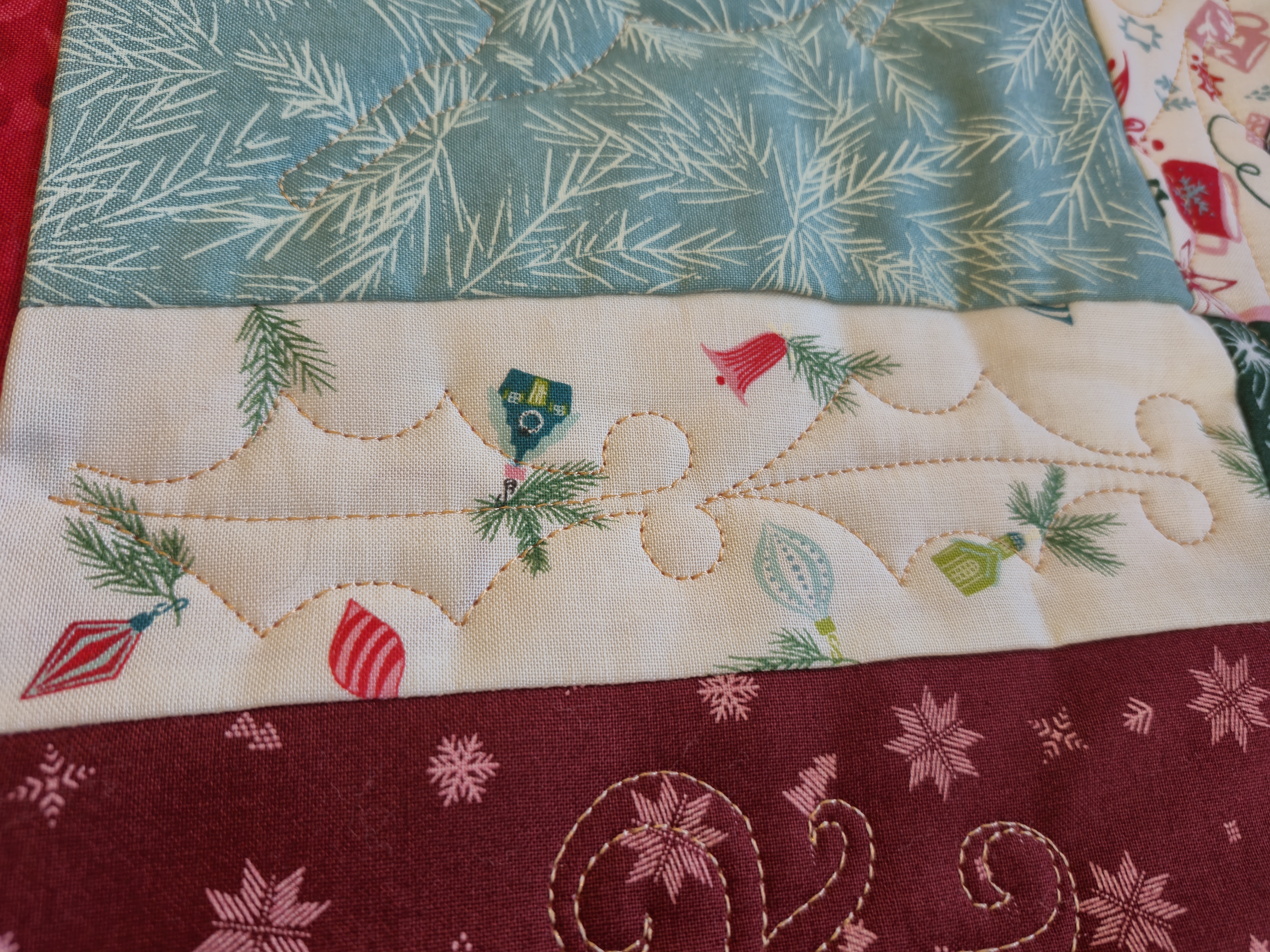 Holly design quilting on Margaret's Christmas quilt