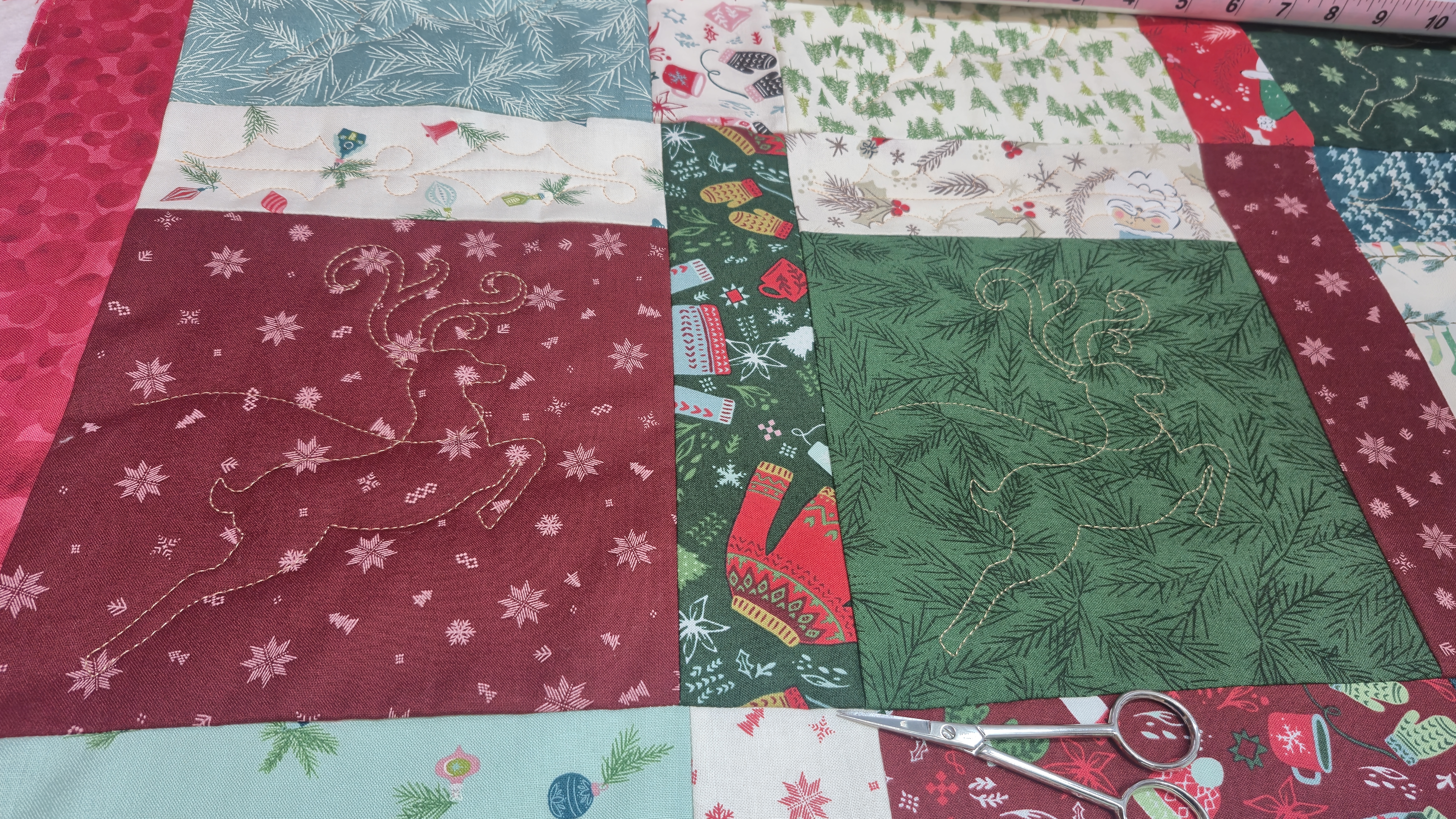 reindeer quilted on a longarm machine for margaret's Christmas quilt