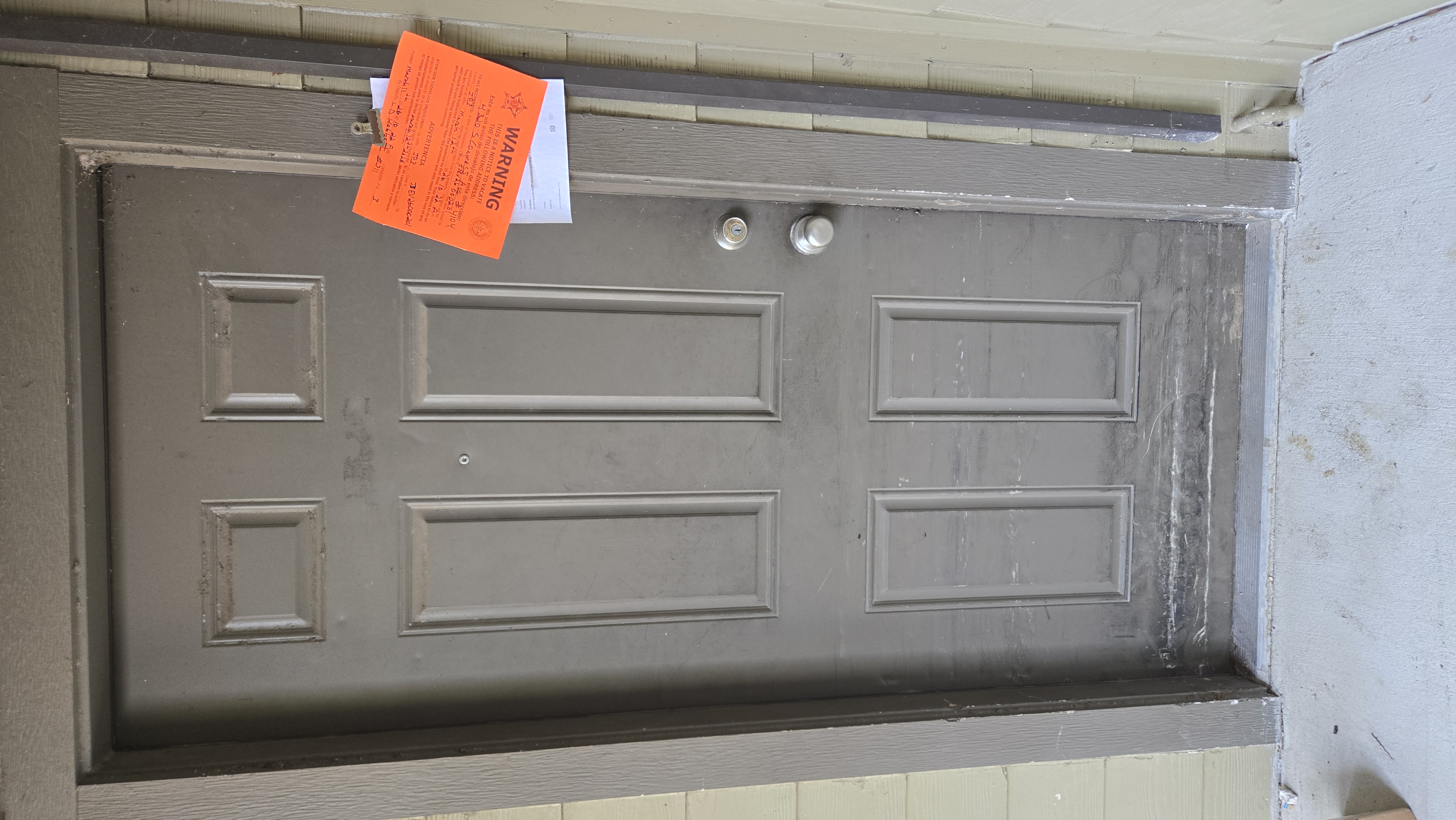 Notice to vacate posted on unit door