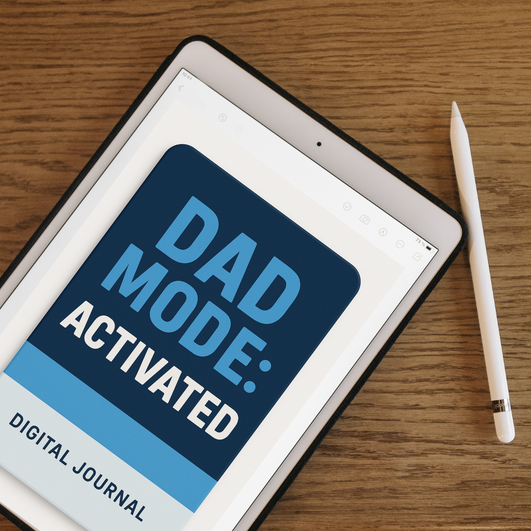 Digital tablet showing the Dad Mode Activated Journal cover beside a pencil—fatherhood mindset challenge tool.