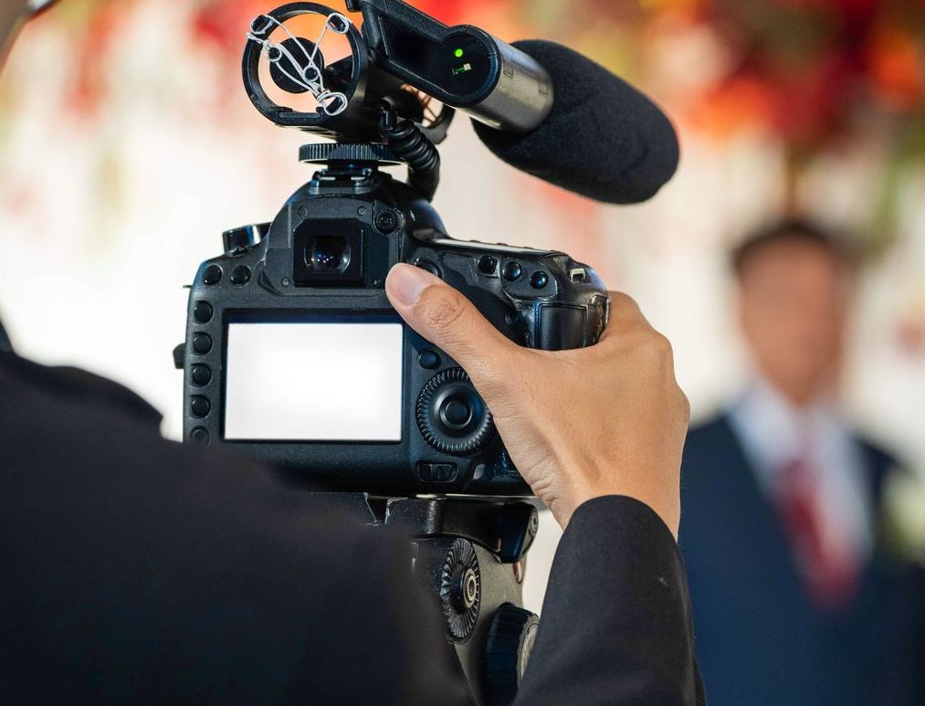 Camera recording magician stage performance