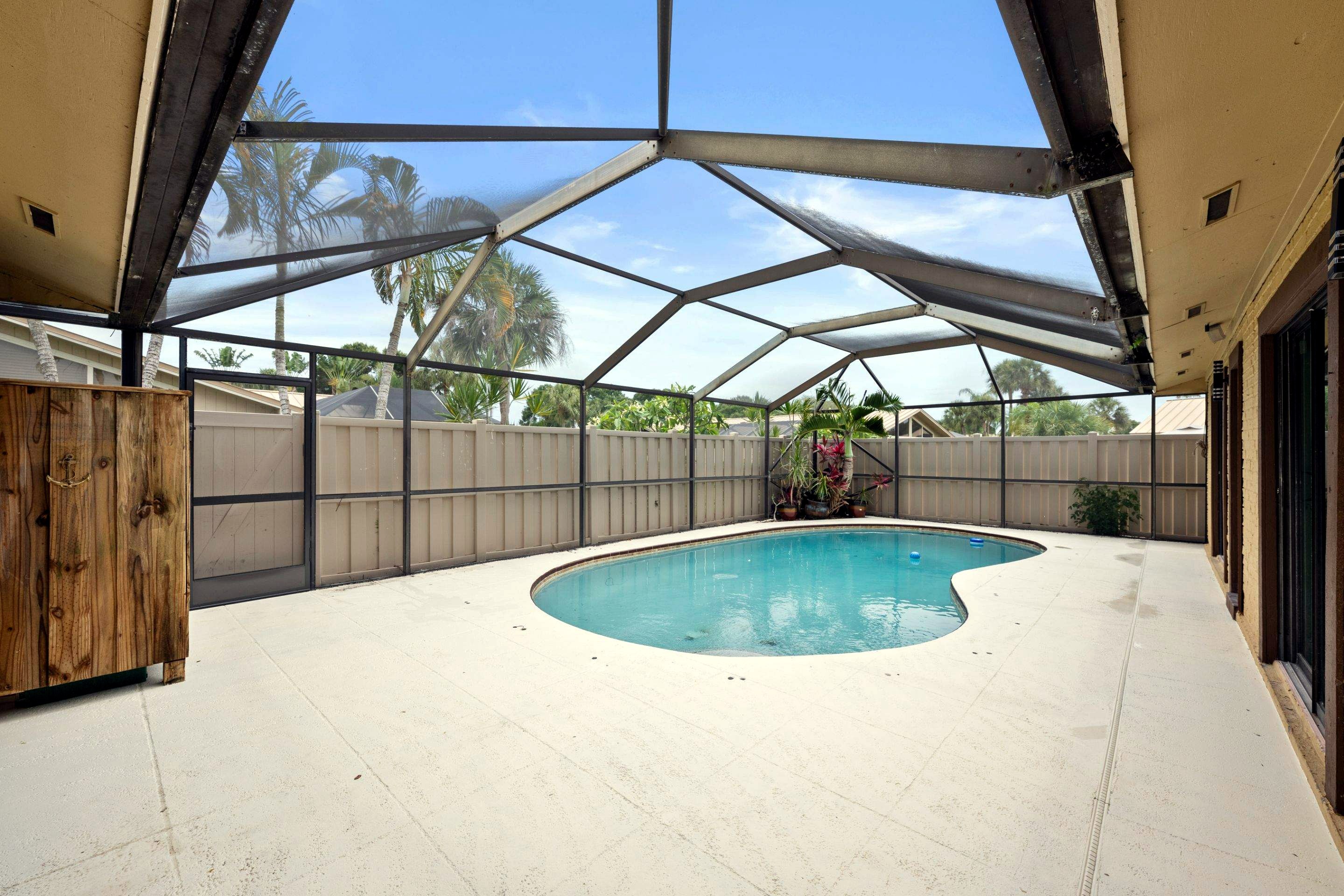 After: clean pool with repaired deck and replaced screen enclosure