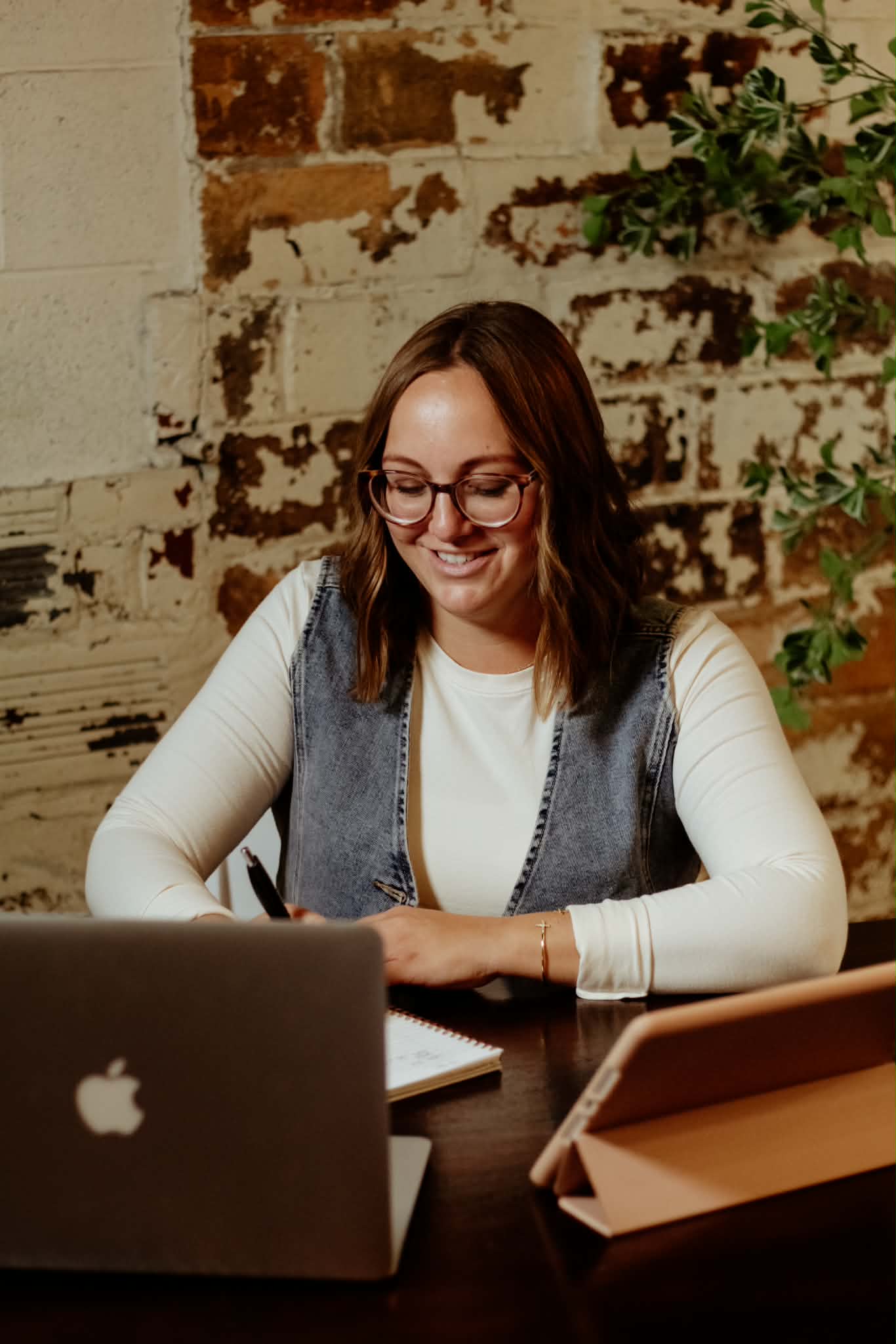 Crista planning at her desk