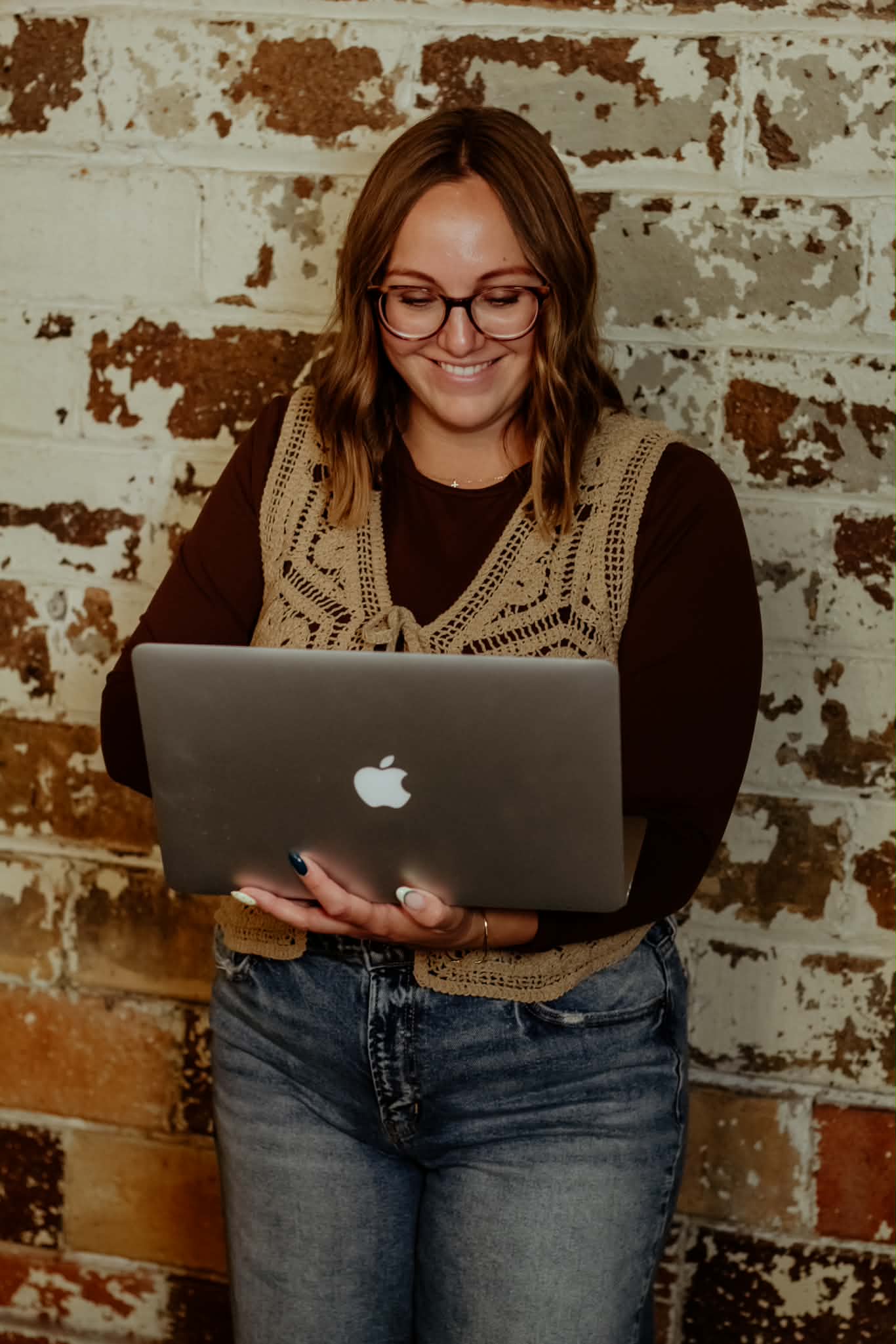Crista working on a laptop