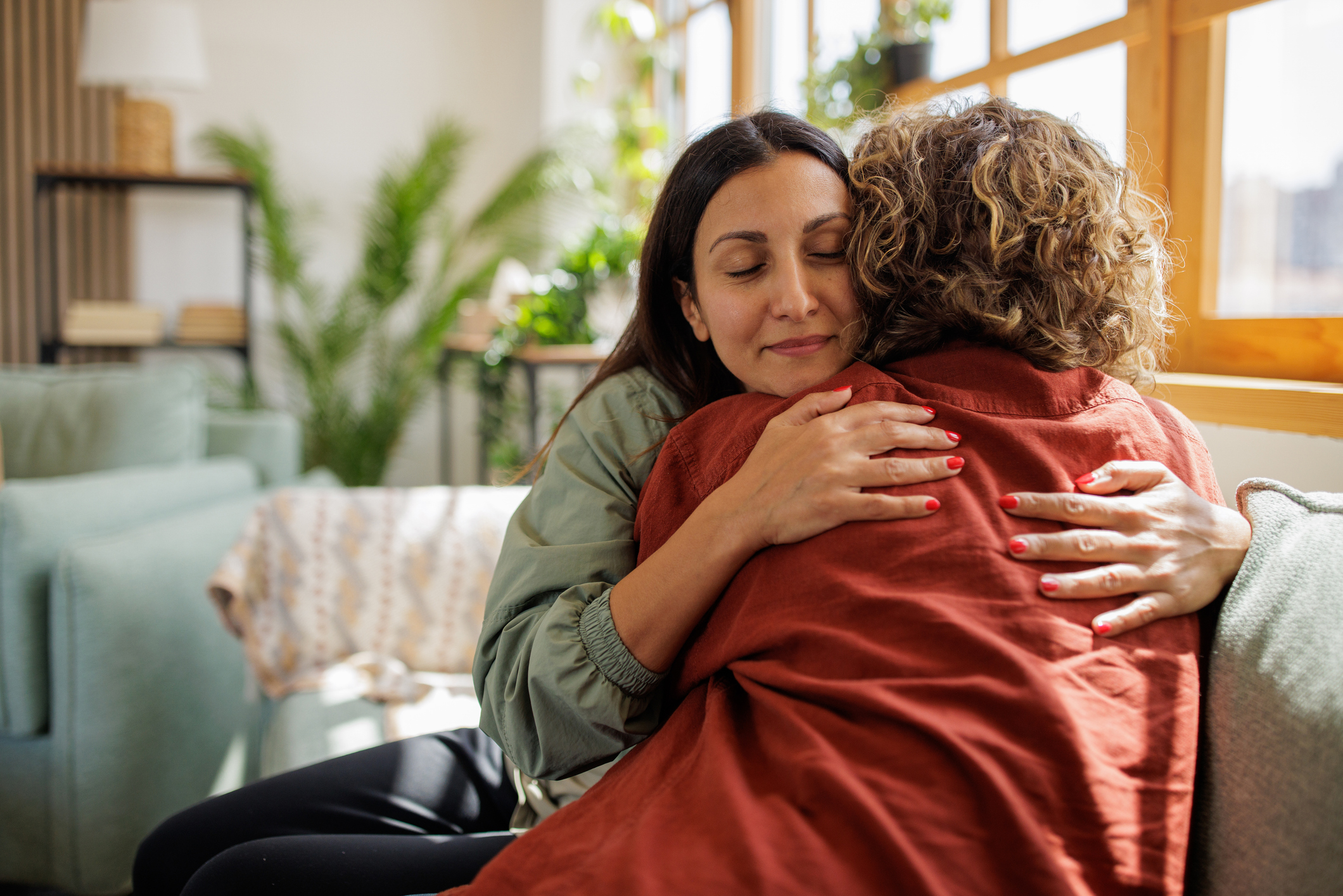 Two women sharing a supportive embrace