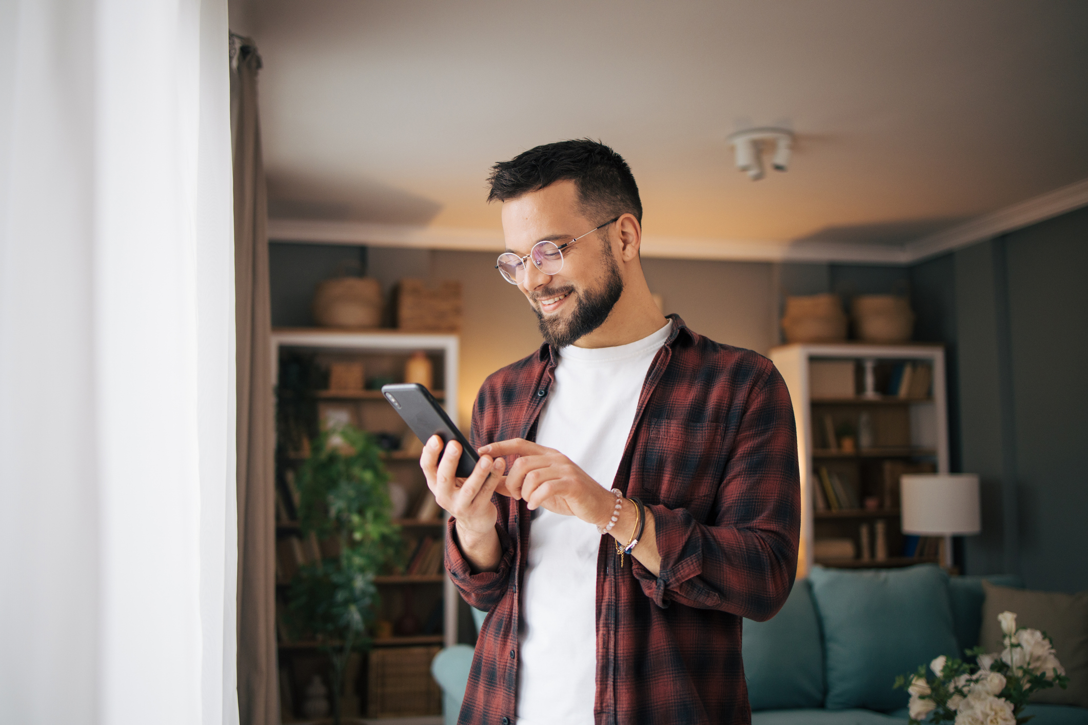 A Grō customer using his phone