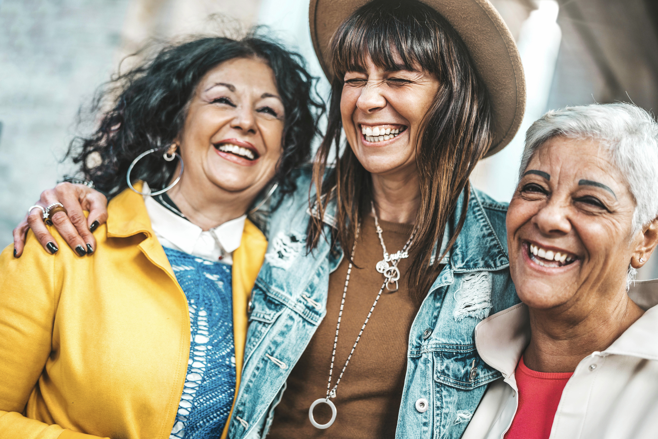 Three friends laughing together