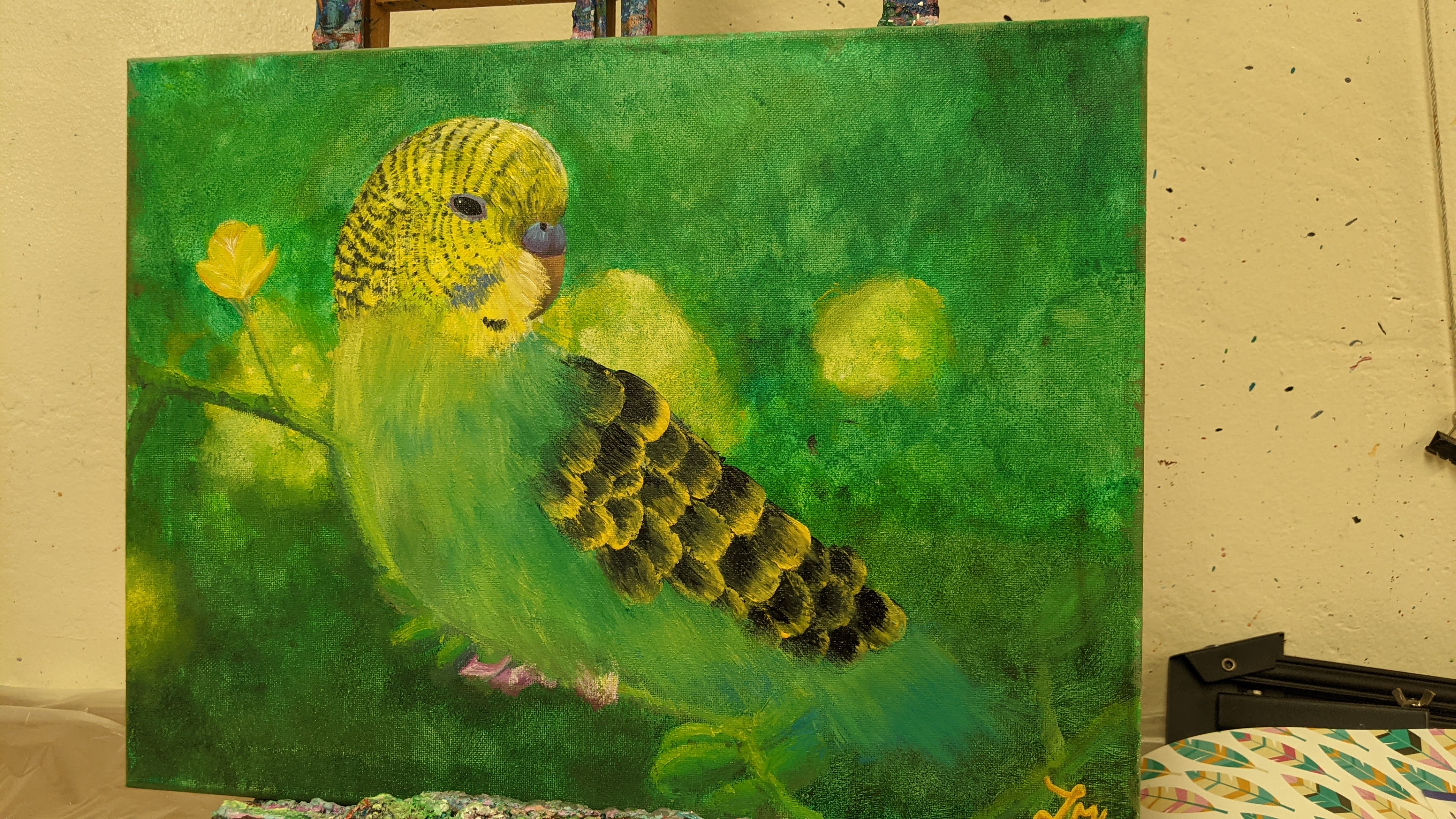 Child painting a colorful canvas at art camp